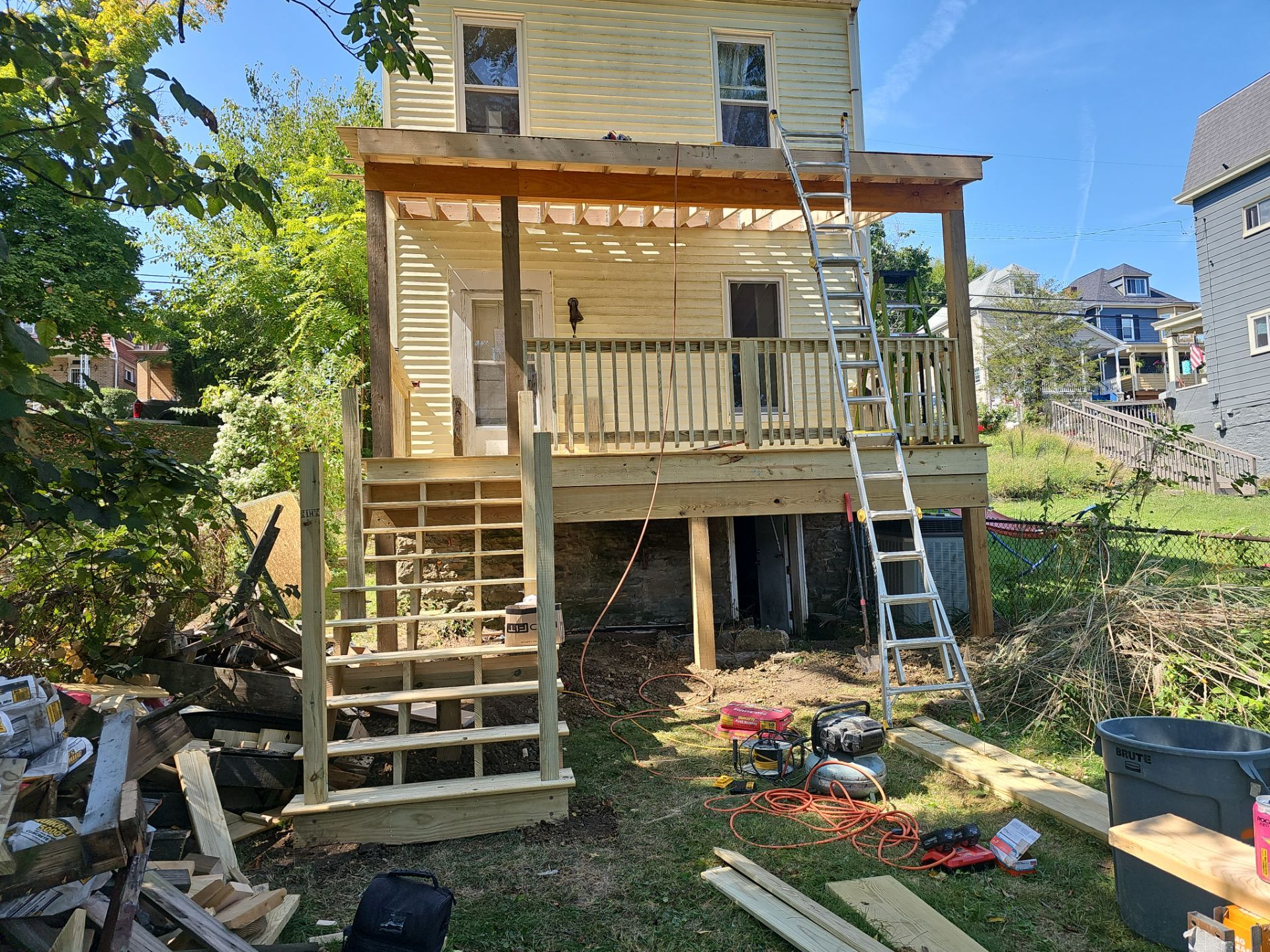 Deck and shed roof by Cousins Roofing Siding & Decks