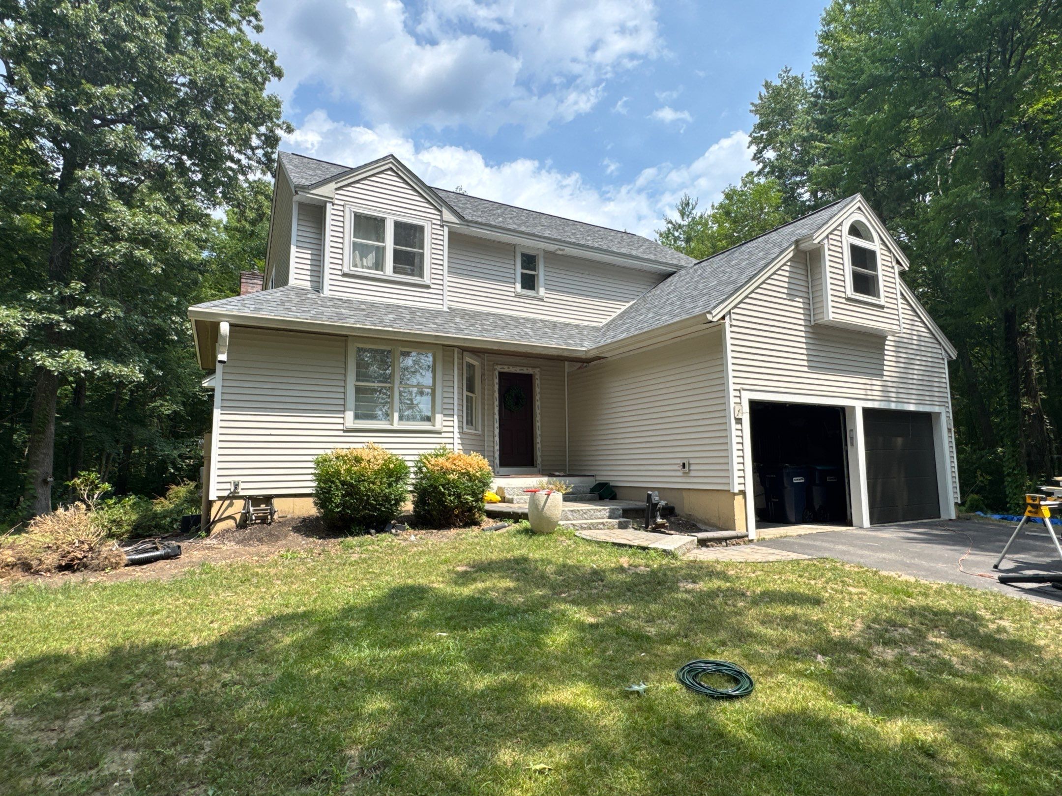 Complete Exterior Remodel in Stratham, NH Near Turnberry Road with Roofing, Siding, Windows, Gutters, and PVC Trim by Compass exteriors