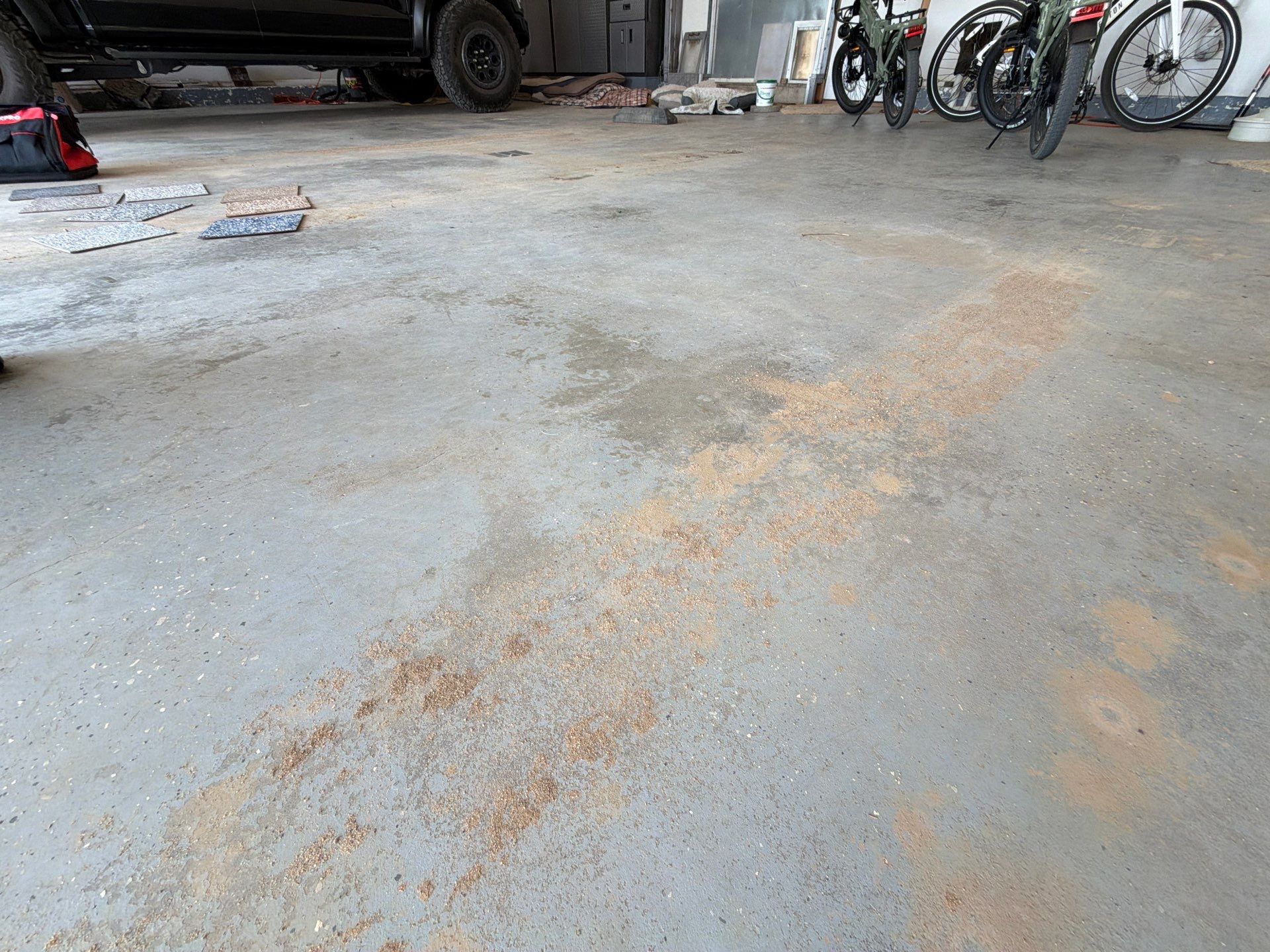 Feather Grey Garage Floor Coating Installation in Valley Springs by Select Painting, Coatings & Garage Cabinets