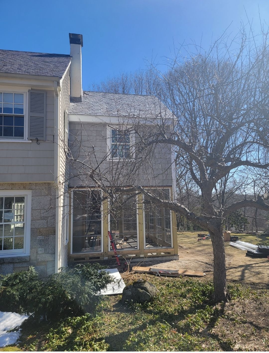 Wood Clapboards and vinyl Slate roof with new Pella windows in Wellesley. by UBrothers Construction