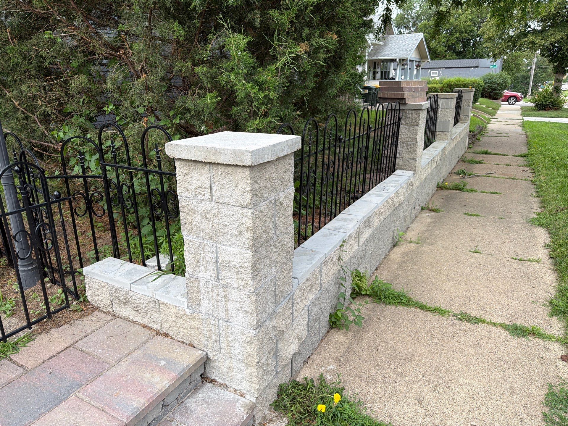 Exterior Masonry Painting for a Sioux Falls Retaining Wall by Select Painting, Coatings & Garage Cabinets