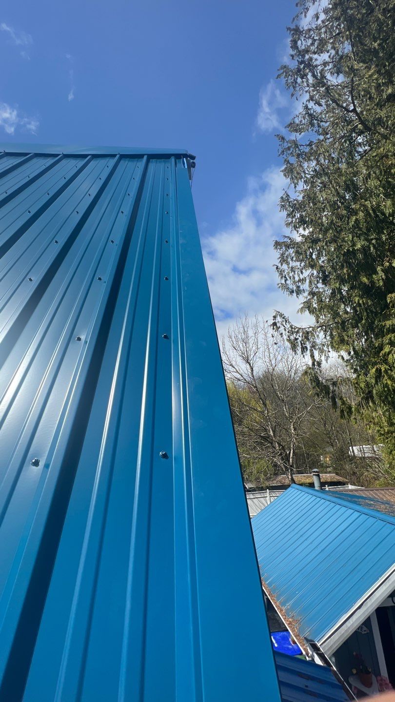 Residential ReRoofing Installation using Duraclad 26ga by Top Notch Roofing Inc