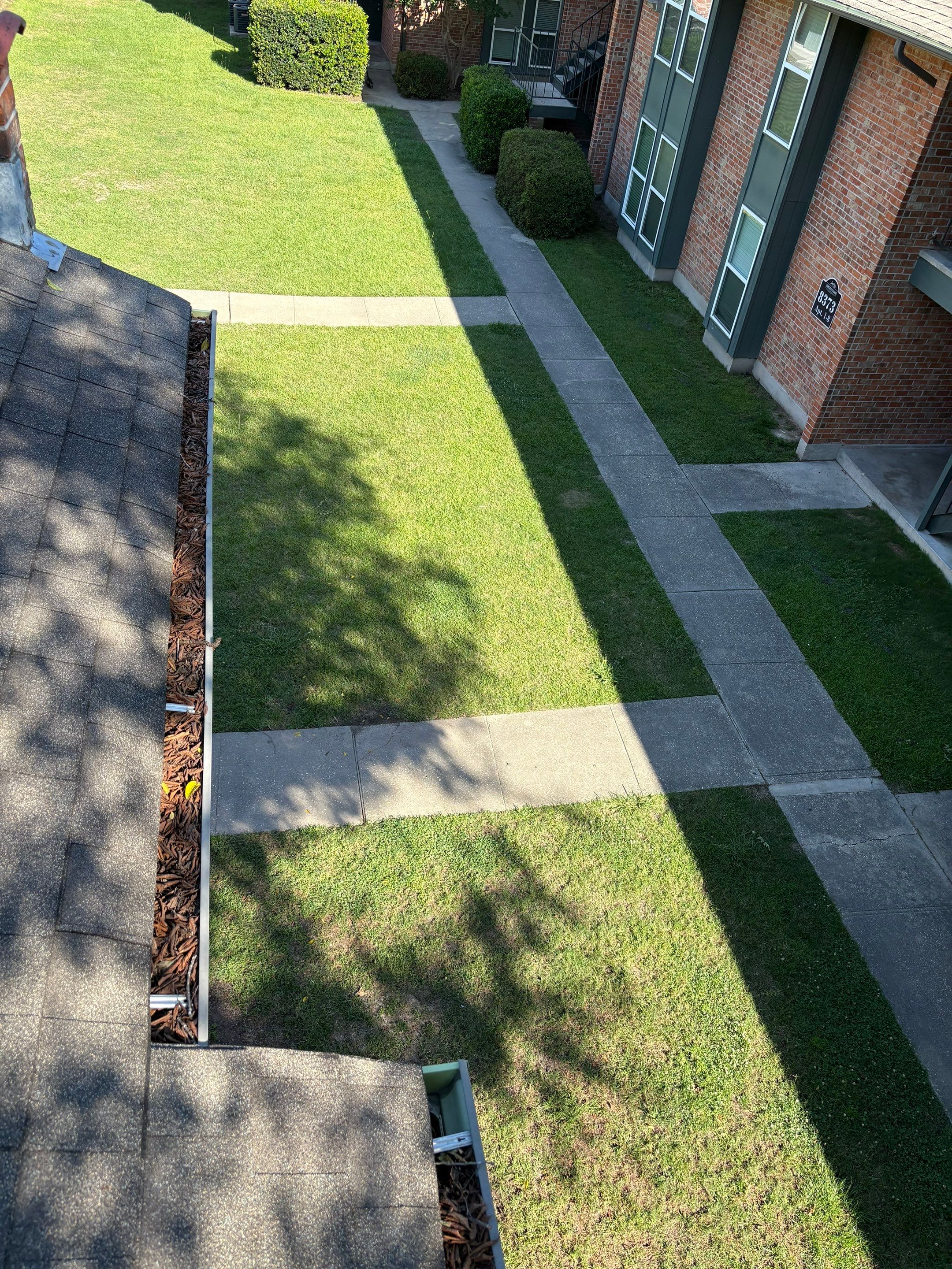 Commercial gutter cleaning Louisiana before photo with filled gutters