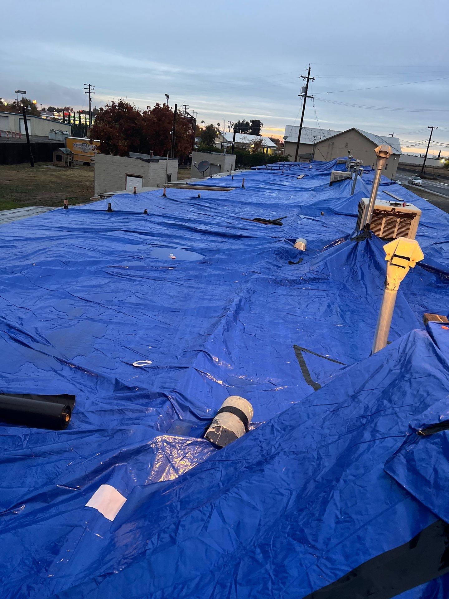 Emergency Roof Tarp Service - Fresno, CA by Grandmark Service Company