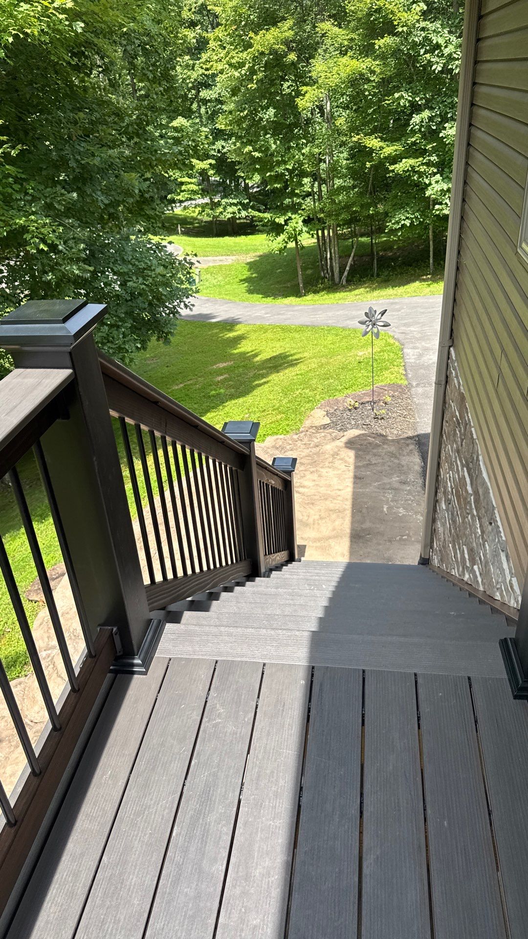 Custom Composite Deck Construction with Stone Pillars in Fayetteville by Walnut Hollow Decks & Outdoor Living