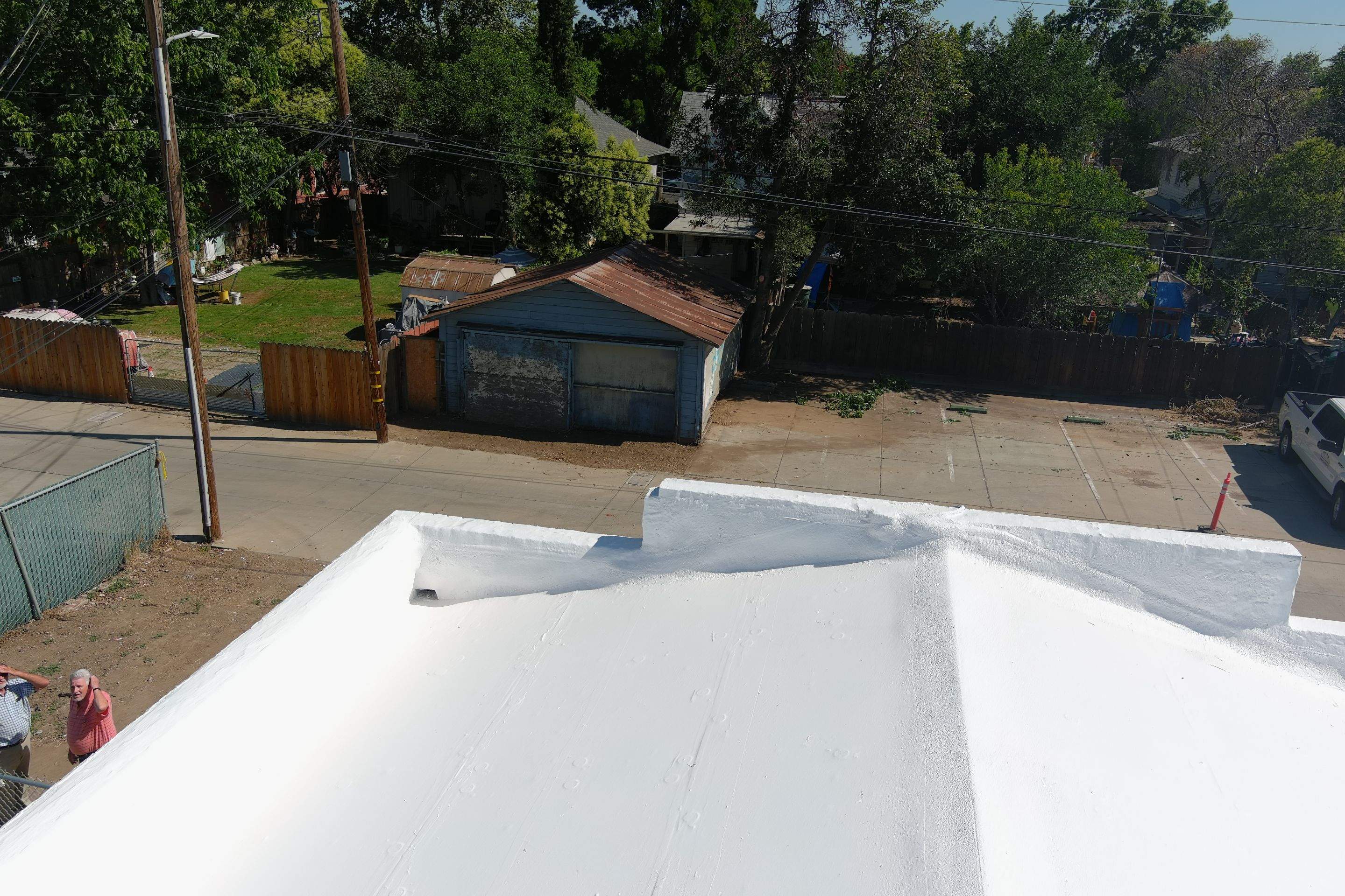 Commercial Roofing Installation using Conklin BenchPly system with PUMA top coat (imbedded fabric system) by Straight Edge Roofing Inc