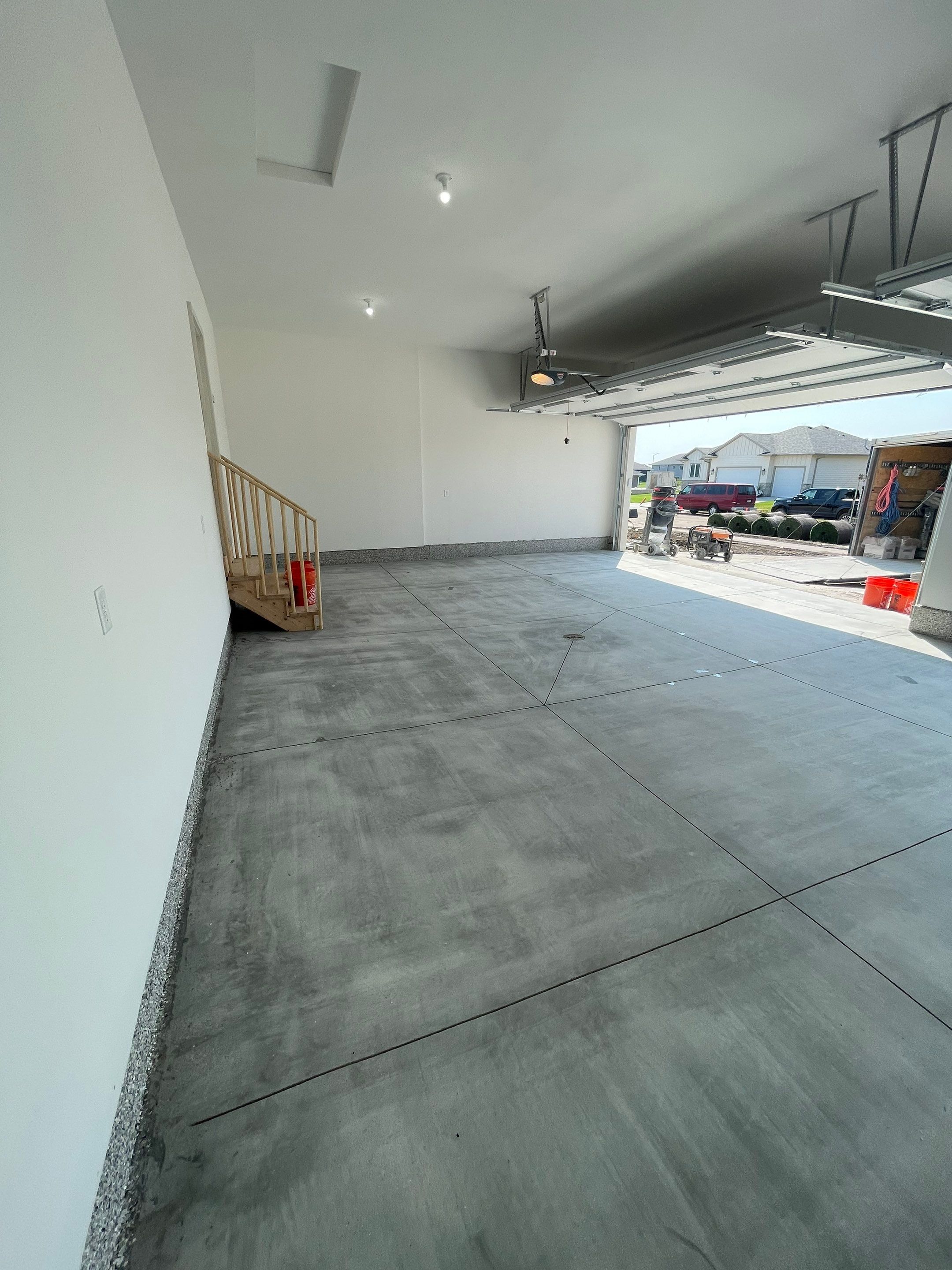 Grey Speckled Garage Floor Coating in Sioux Falls by Select Painting, Coatings & Garage Cabinets