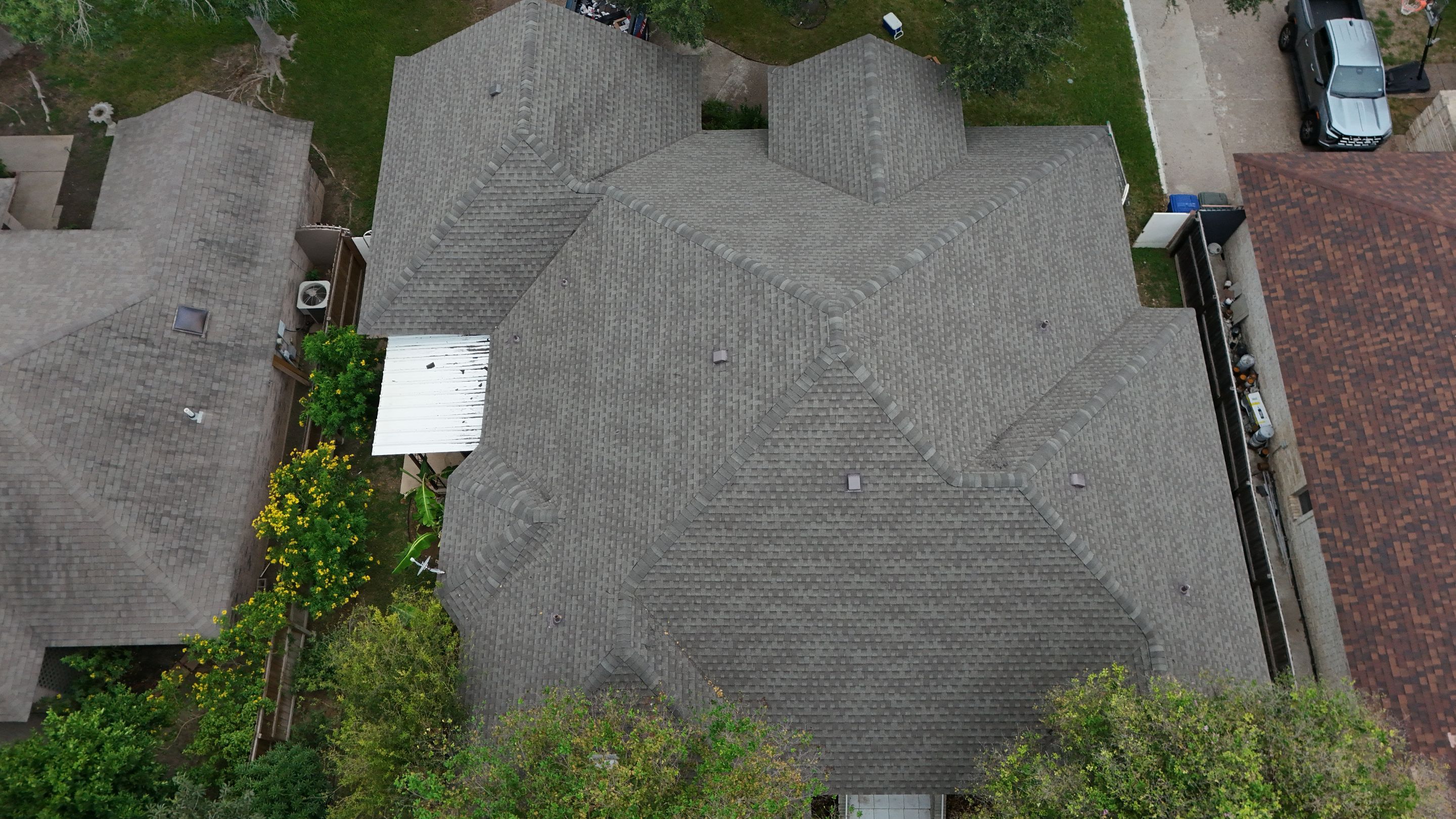 Residential Roof Replacement with Gray Composite Asphalt Shingles in Laredo by JM Flores Roofing & Construction, Inc