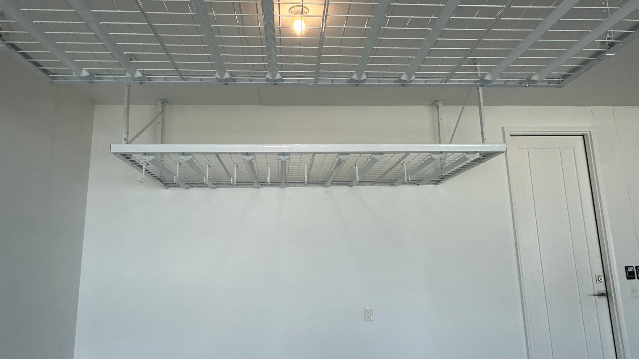 Kendel O. added overhead racks to their garage  by Banner Garage
