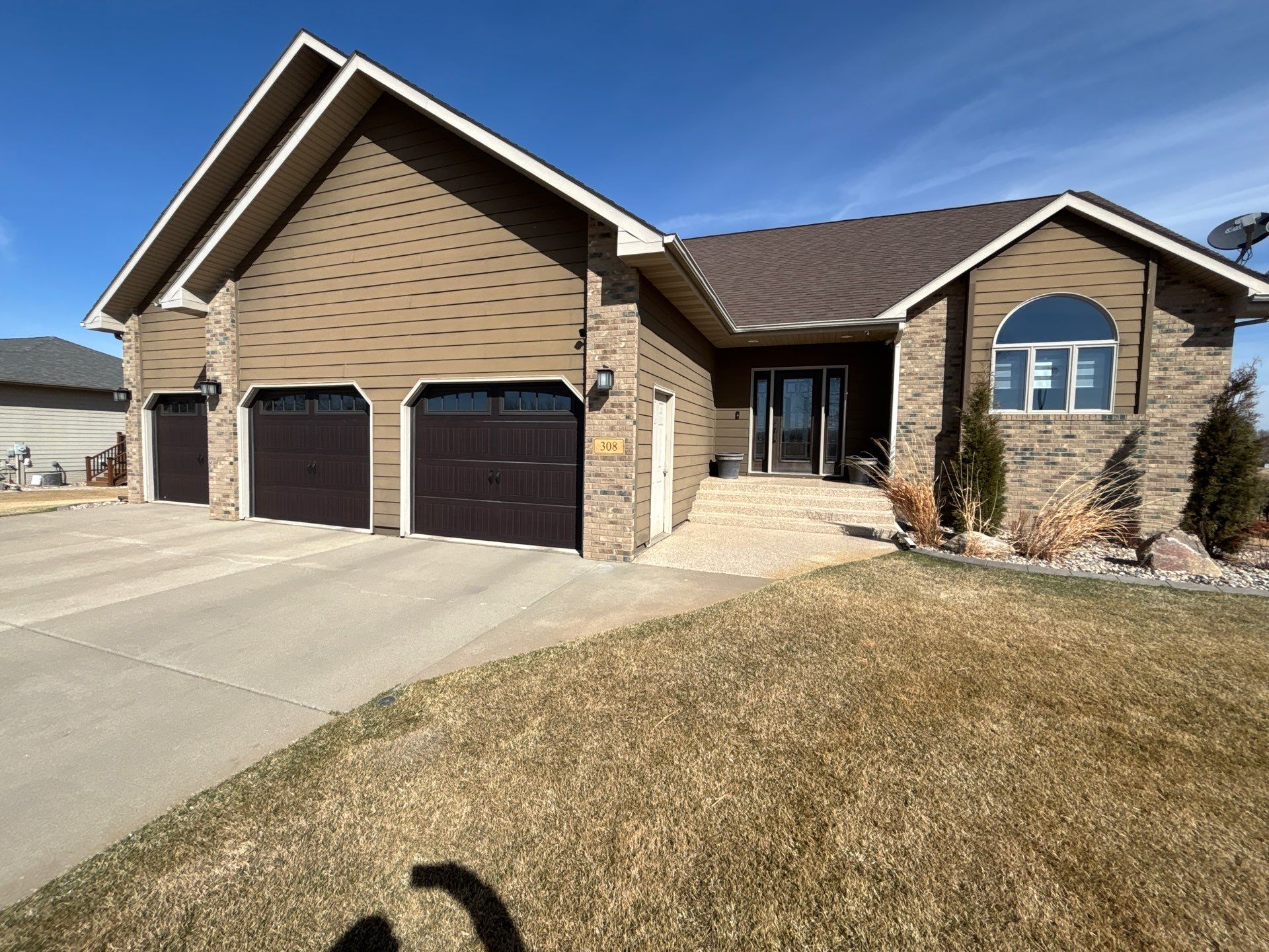 Full Exterior Renovation with Stone Veneer and Composite Decking by Select Painting, Coatings & Garage Cabinets
