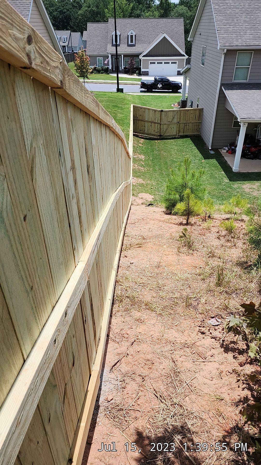 Fence Installation of Capped Wood Privacy by Titans of Timber Fence & Stain