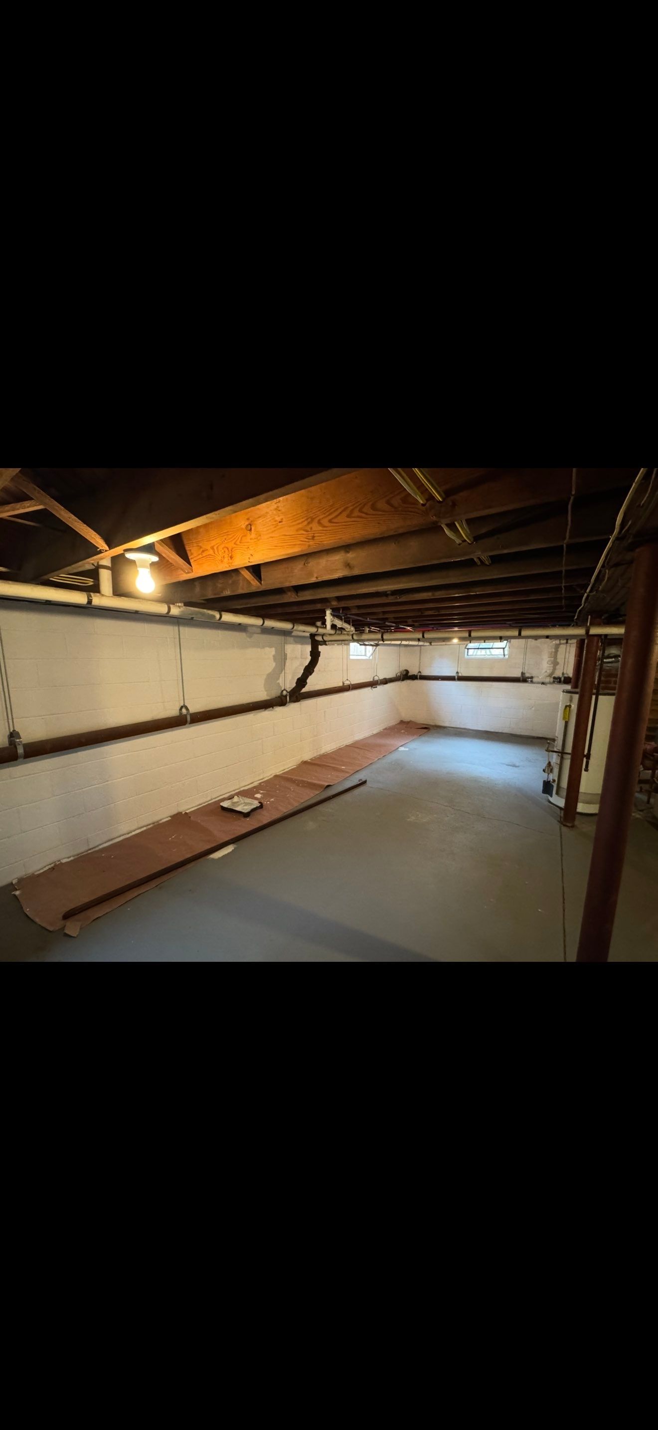Window wells, exterior painting, basement waterproofing. by AXR Inc