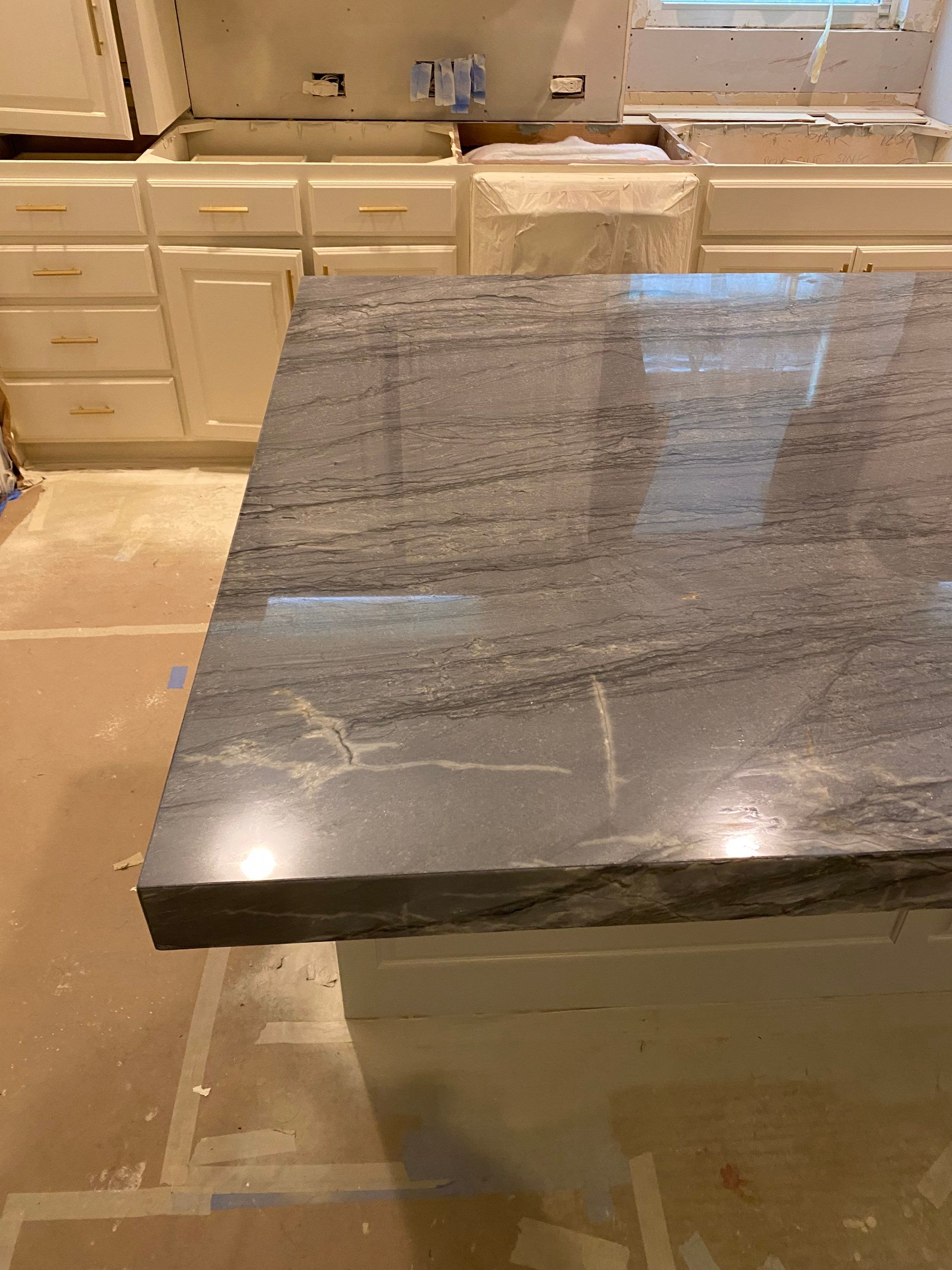 Kitchen Remodel using Quartzite by SLM General Contractors & Roofing