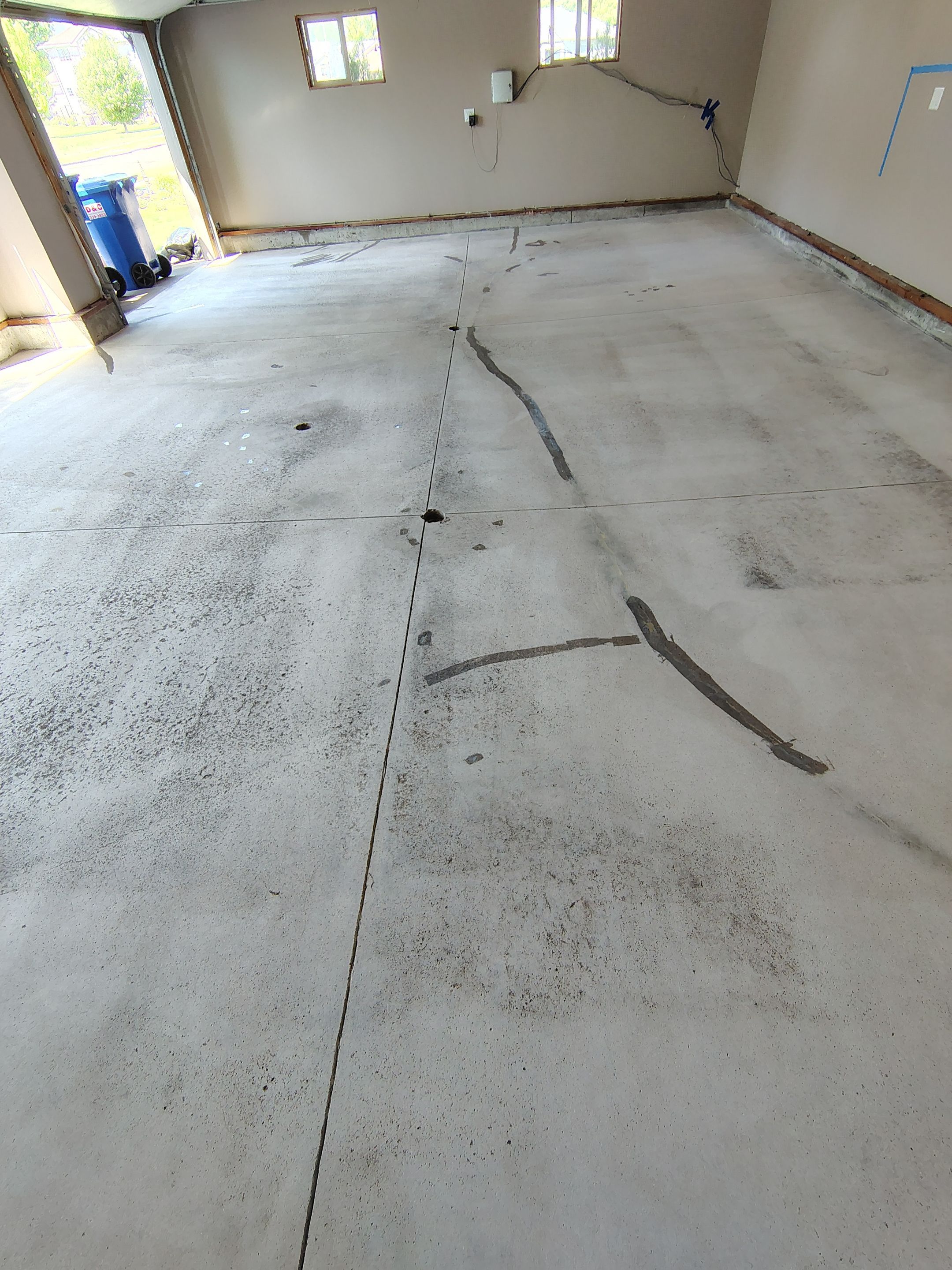 Sioux Falls Garage Concrete Repair and Epoxy Flake Floor Coating by Select Painting, Coatings & Garage Cabinets