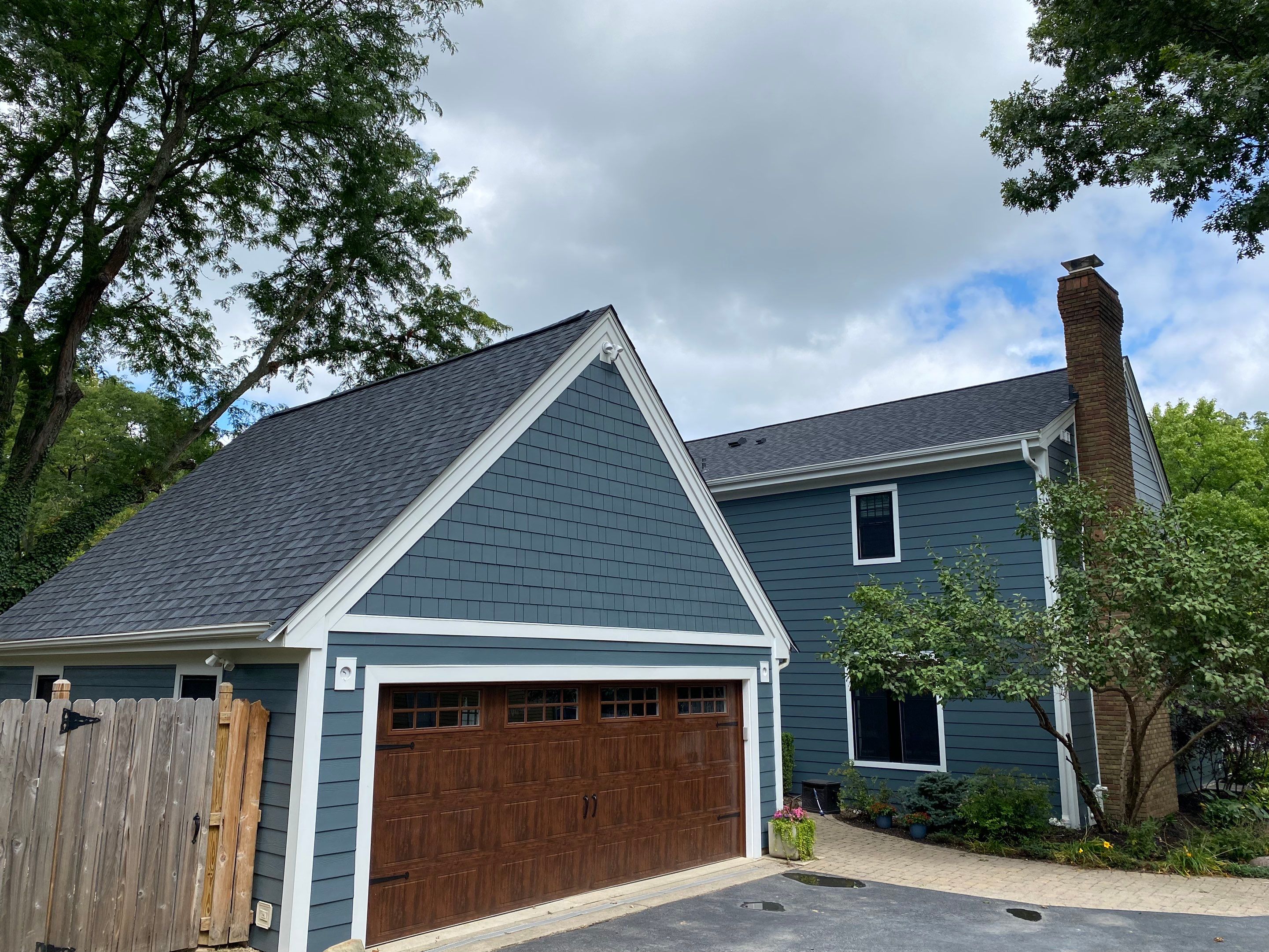 Residential Roofing Installation using James Hardie Fiber Cement Lap Siding and Certainteed Landmark Pro Shingles by Best Exteriors Inc