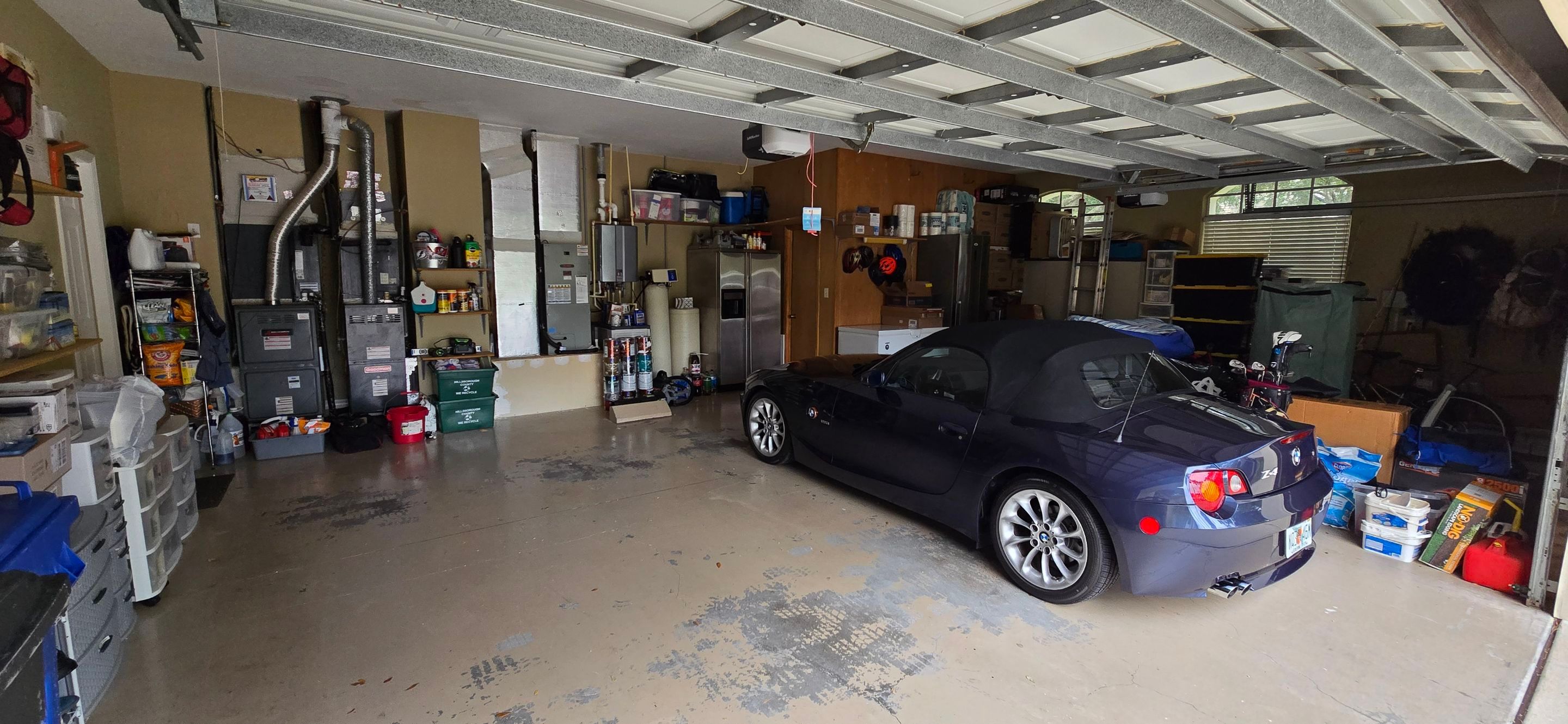 Tampa Garage Floor Coating and Overhead Storage Rack Installation by Square 1 Garage and Closet Solutions