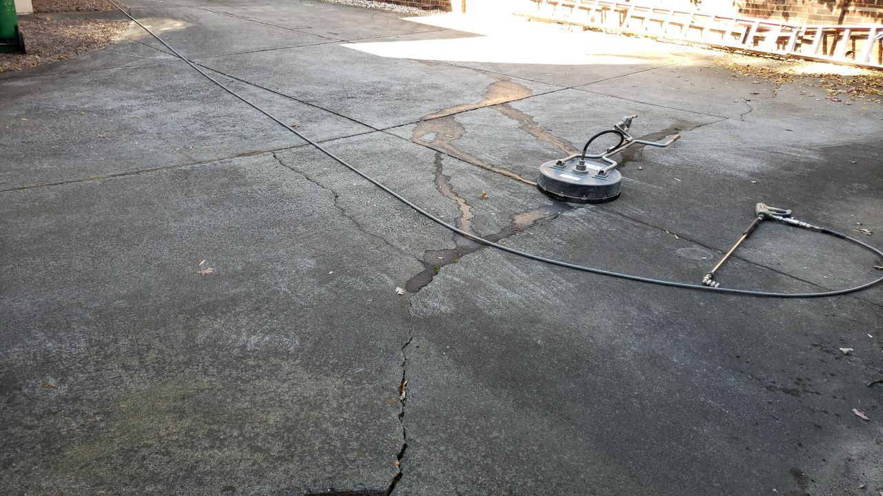 Driveway Clean using cleaner by Power Wash Masters LLC