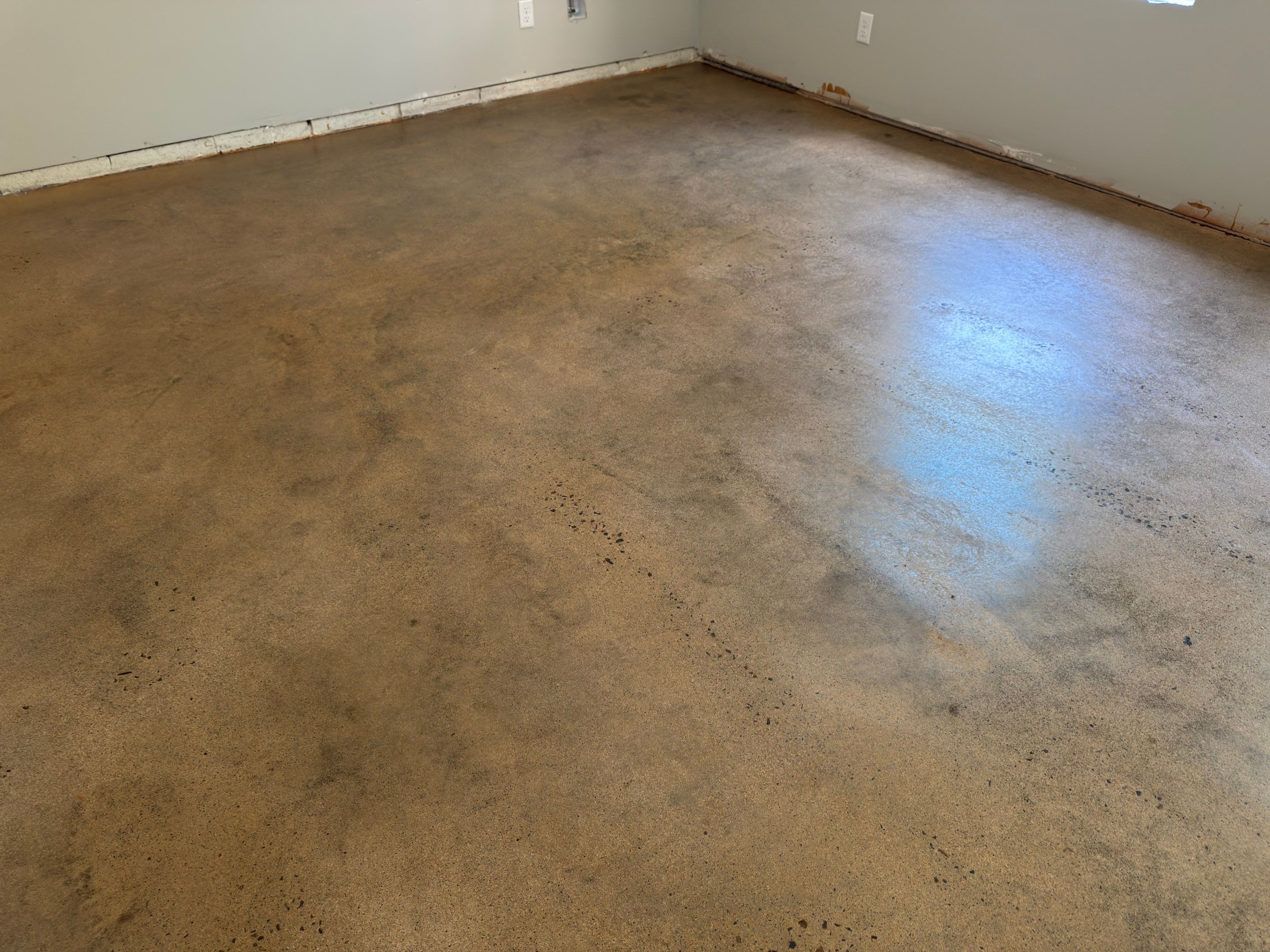 Stained Concrete using Antique Cork by Elite Floor Solutions