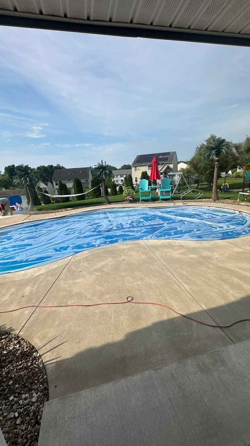 Twilight Pool Deck / Patio Project in Beaver falls by Floors in a Day, Inc