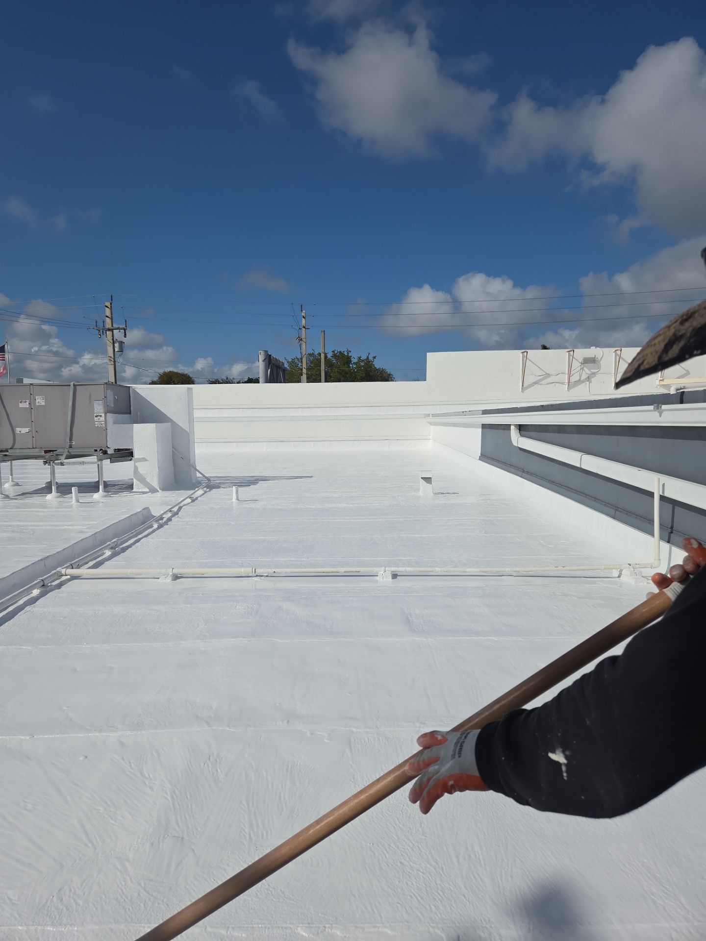 Commercial Flat Roof Restoration Using Silicone Coating in Hallandale Beach by Aastro Roofing