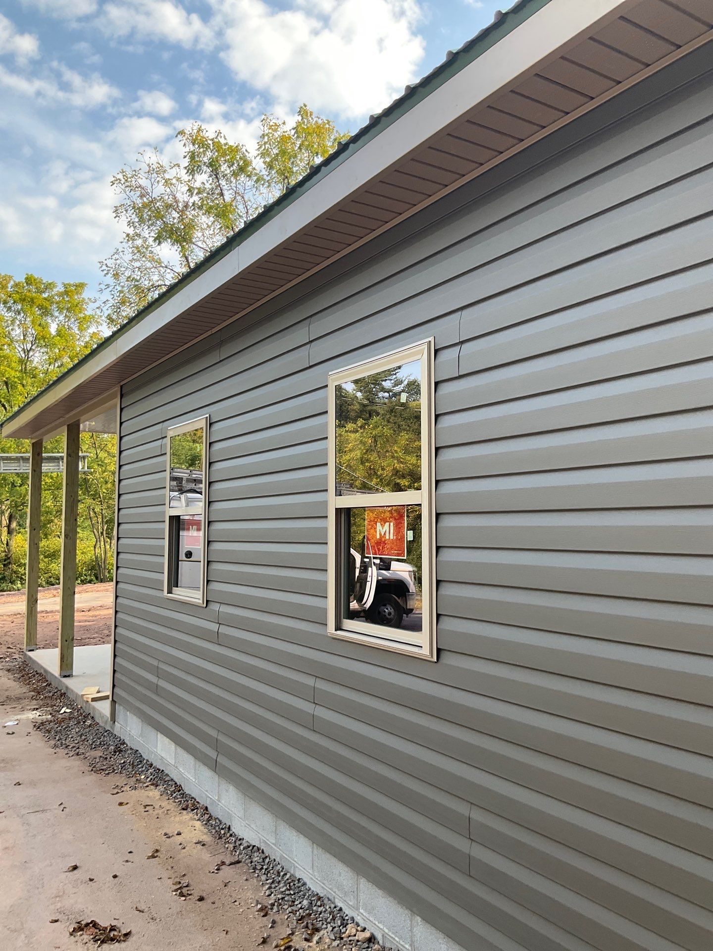 Detached Garage Construction with Vinyl Siding and Metal Roof by Esh Builders