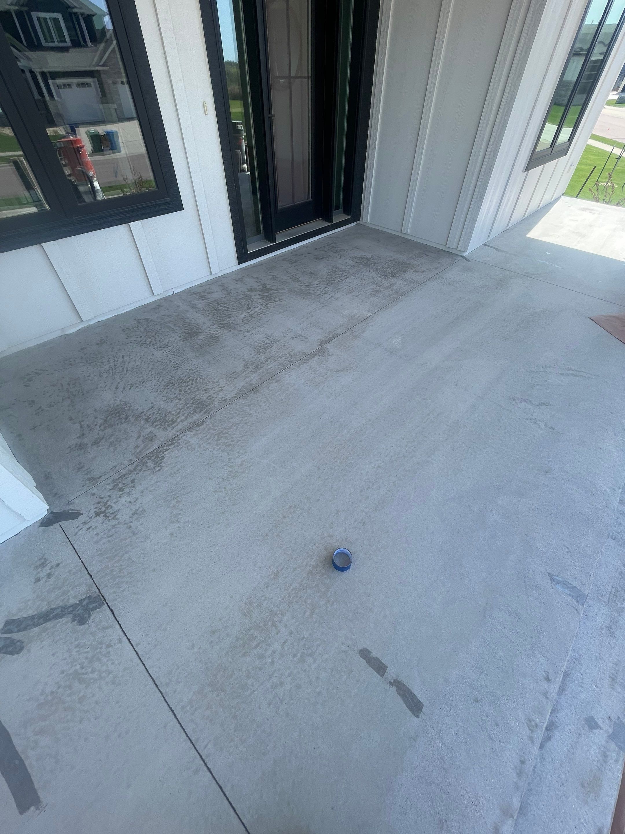 Grey Speckled Concrete Porch Coating for Sioux Falls Home by Select Painting, Coatings & Garage Cabinets