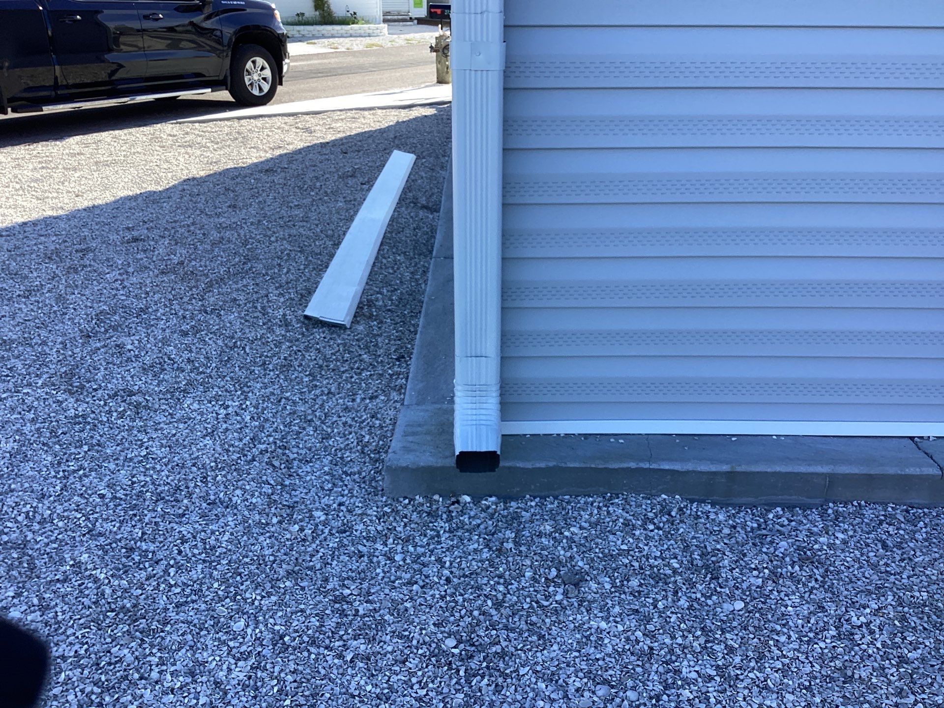 White Downspouts Installation in St. James City by Gutter Professors