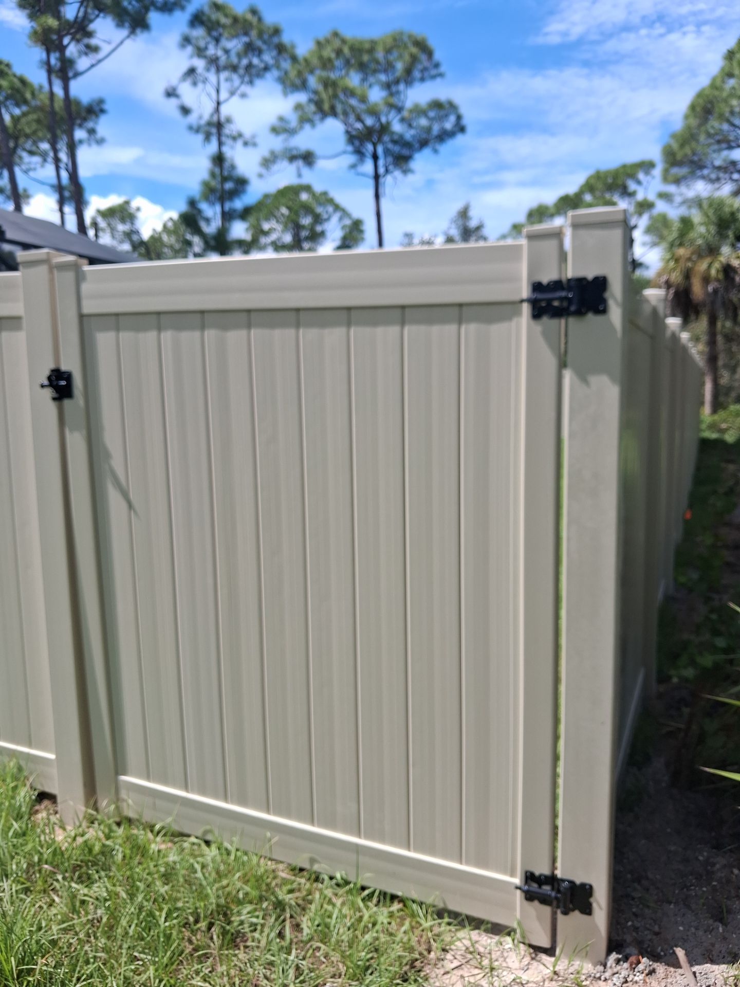 Tan Vinyl Privacy Fence and Gate Installation in Port Charlotte by True Fence LLC