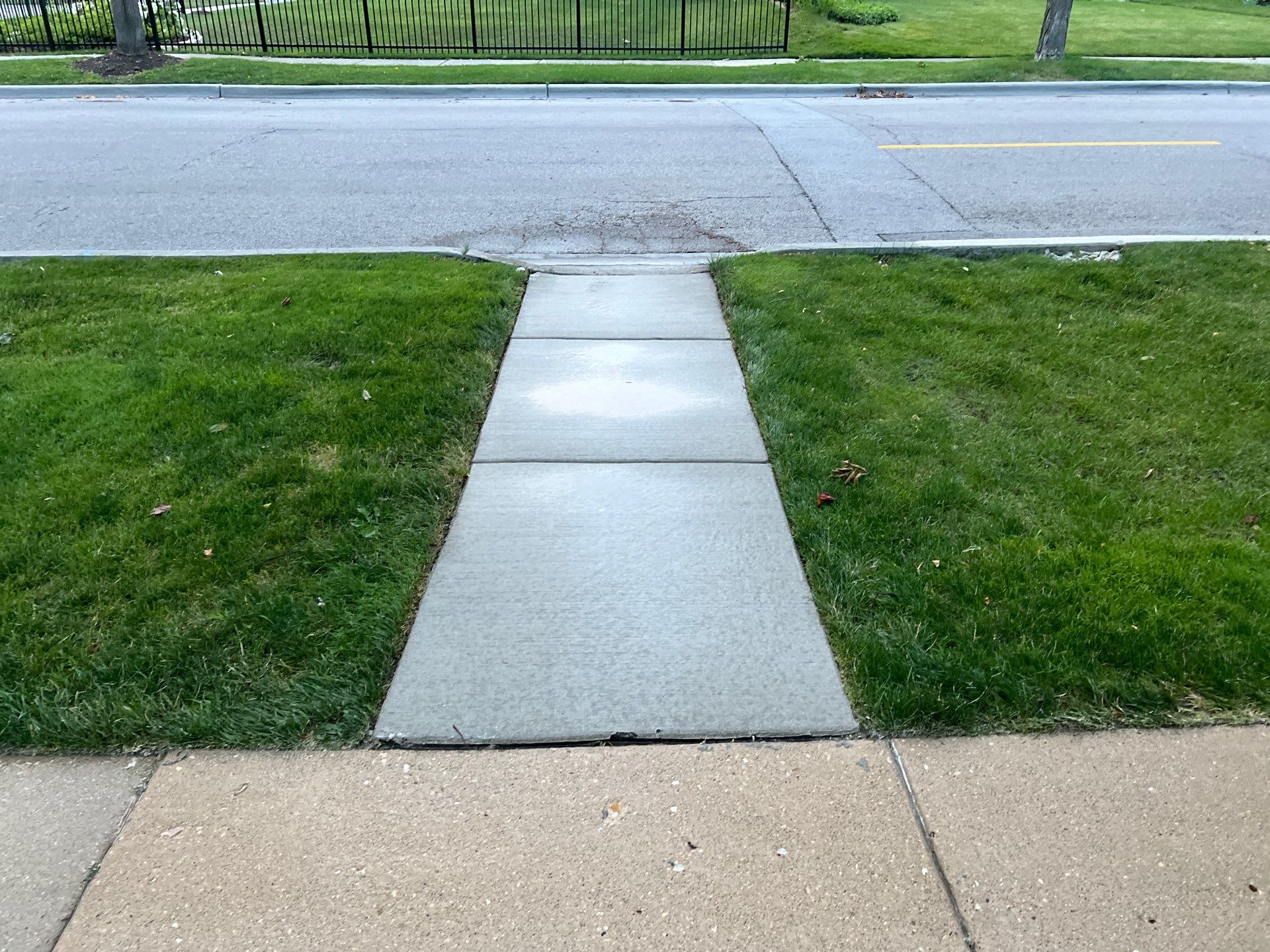 concrete cleaning using Algaecide, soft wash soap by Northern Power Washing LLC.