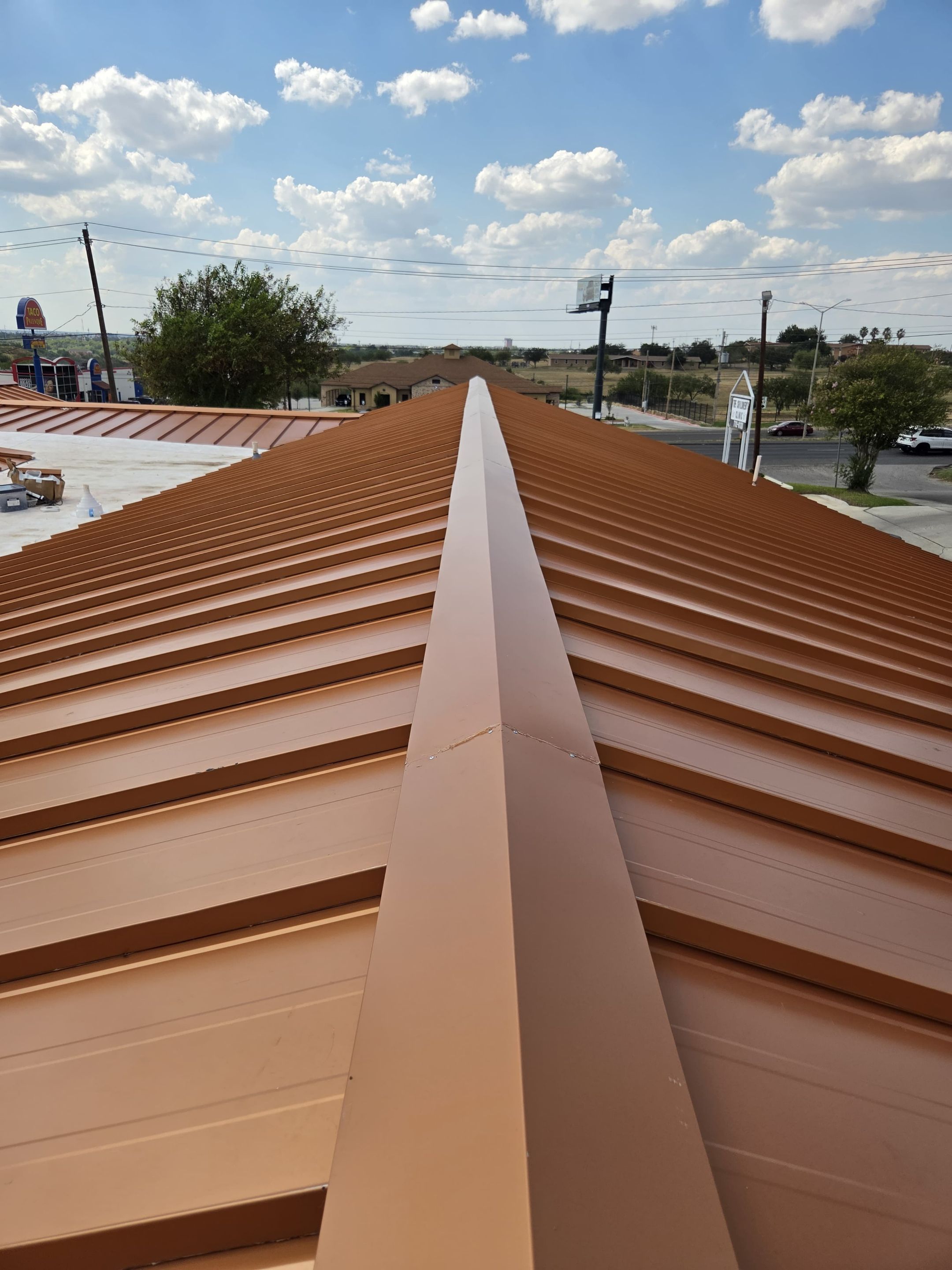 Copper Standing Seam Metal Roof Installation for Laredo Medical Clinic by JM Flores Roofing & Construction, Inc