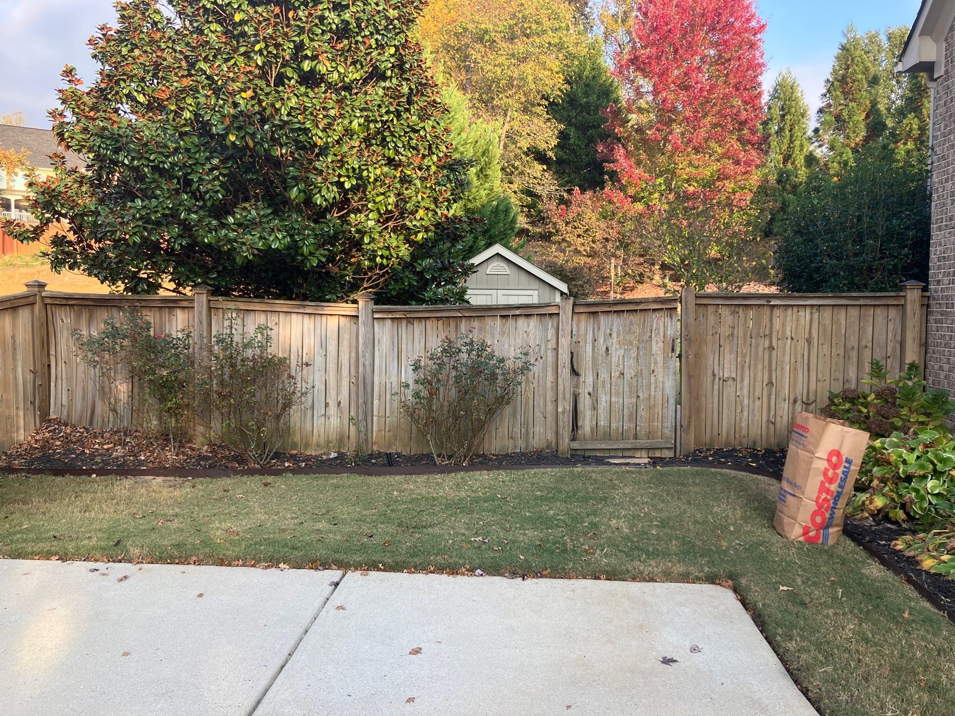 Fence Installation of Capped Wood Privacy Fence using 6X6 posts and copper post caps.  by Titans of Timber Fence & Stain
