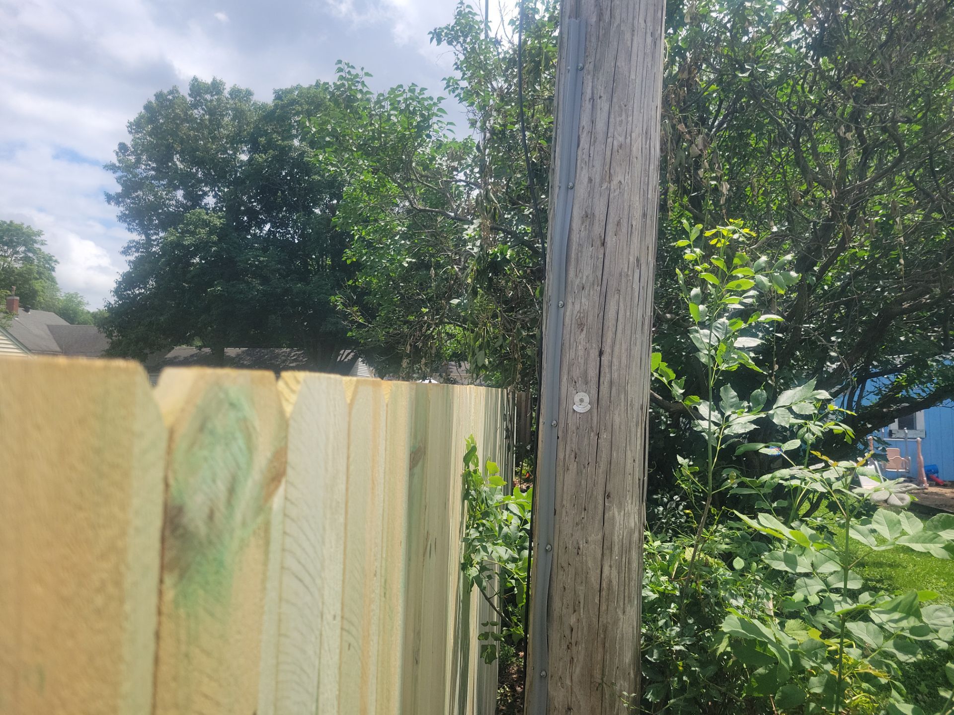 Pressure-Treated Wood Privacy Fence Installation in Charles City by Perfect Picket Fence and Stain