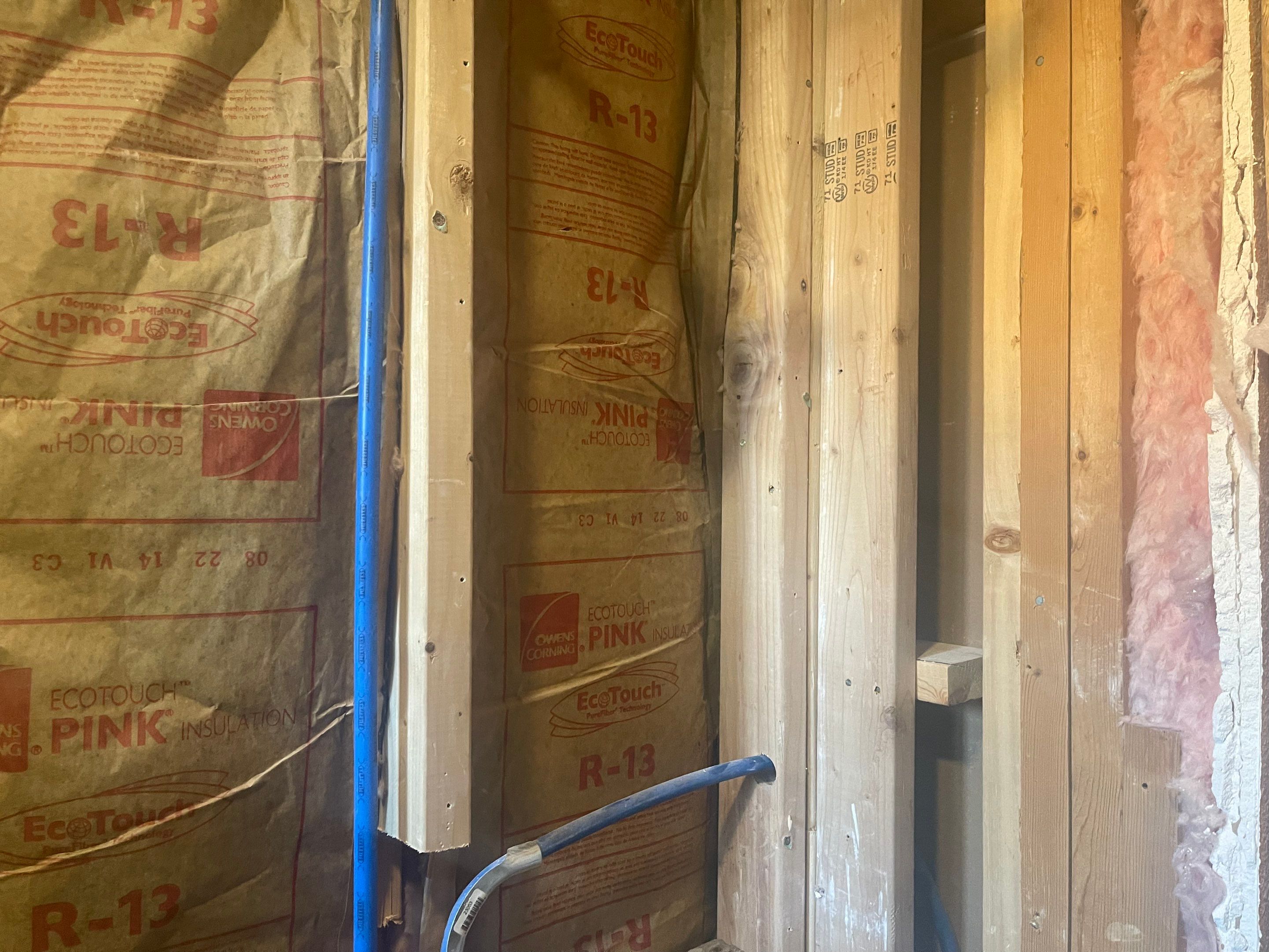 Complete Bathroom Remodel Featuring Marble Tile and Teal Herringbone Niche by Mena stone surfaces