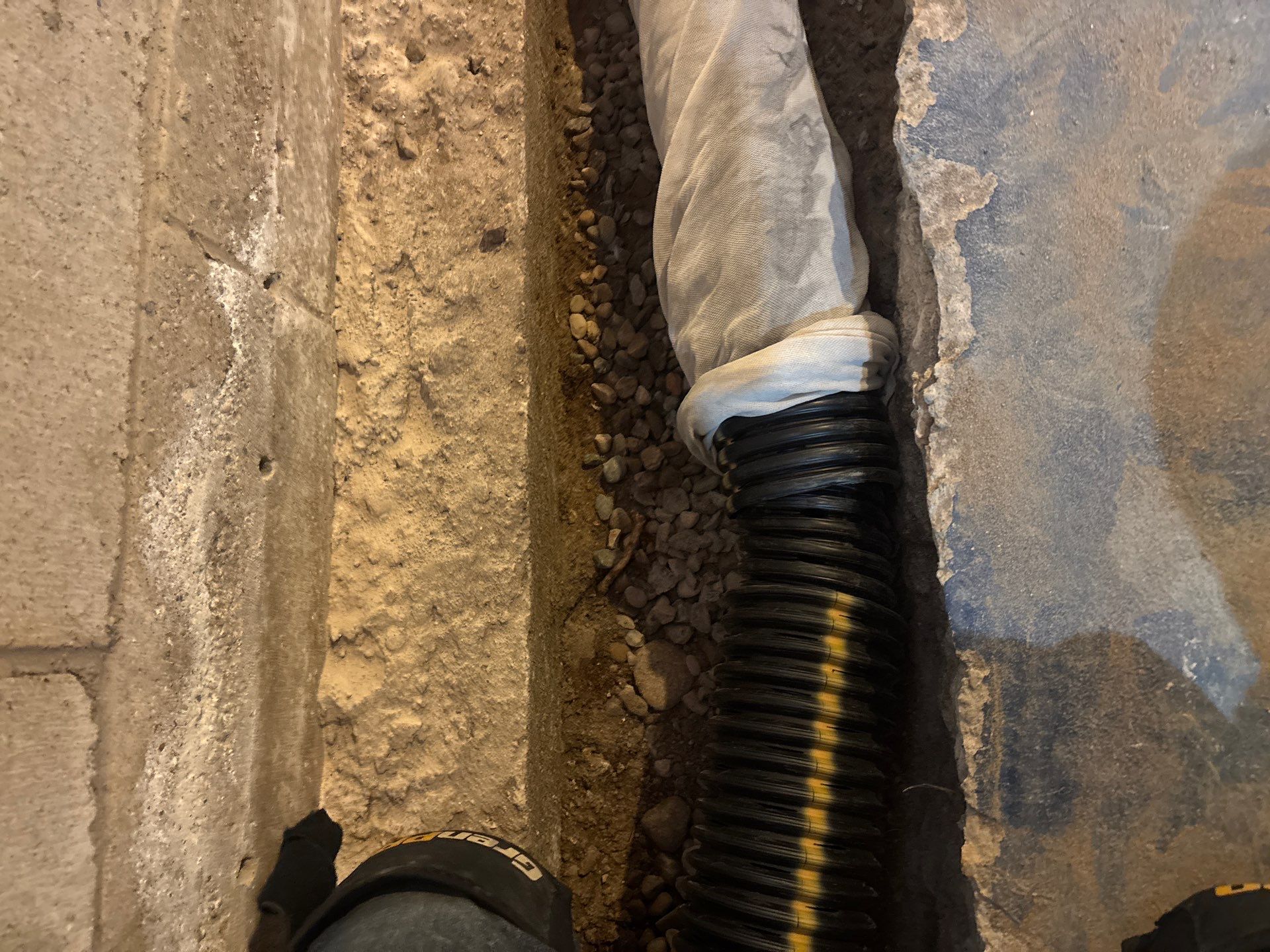 Interior Drain Tile & Buried Discharge in South Minneapolis by Waterproofing Northeast