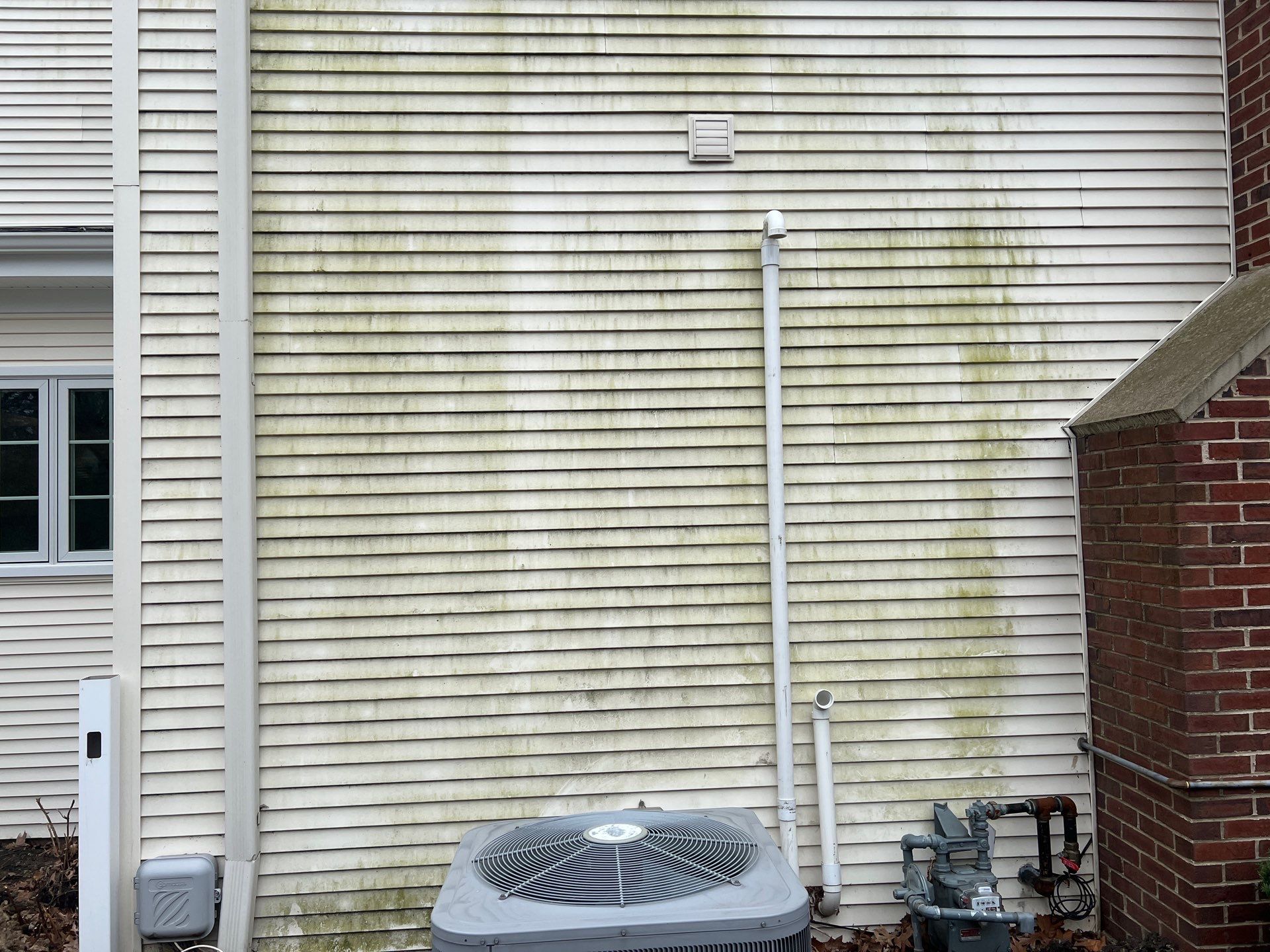Housewashing  using Algaecide, soft wash soap by Northern Power Washing LLC.