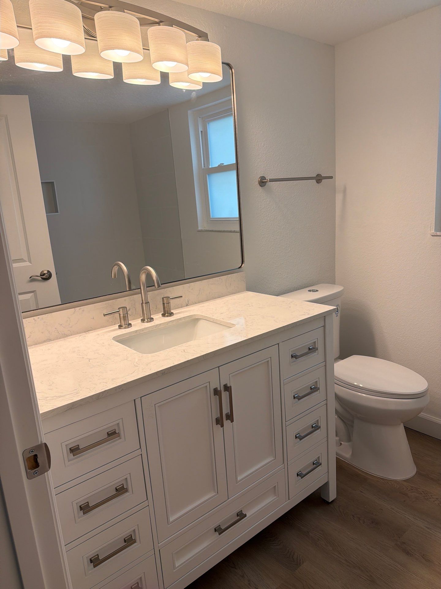 Full Condominium Remodel Featuring Aubrey Oak Flooring In Daytona Beach by Acies Renovations
