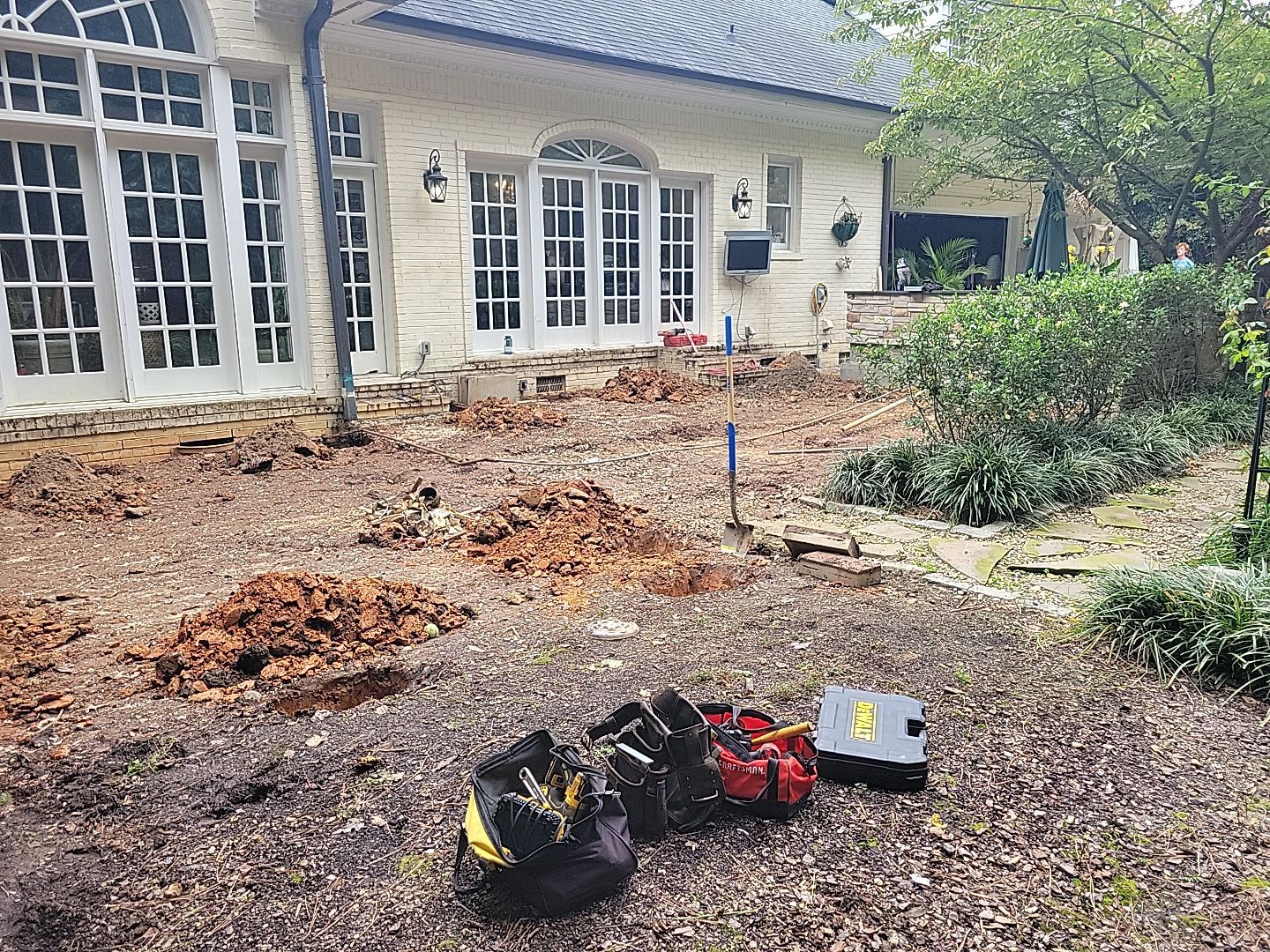 New Deck, Stone Fountain Feature, Circle Stone Sitting Area with Fireplace by The Remodeling Company