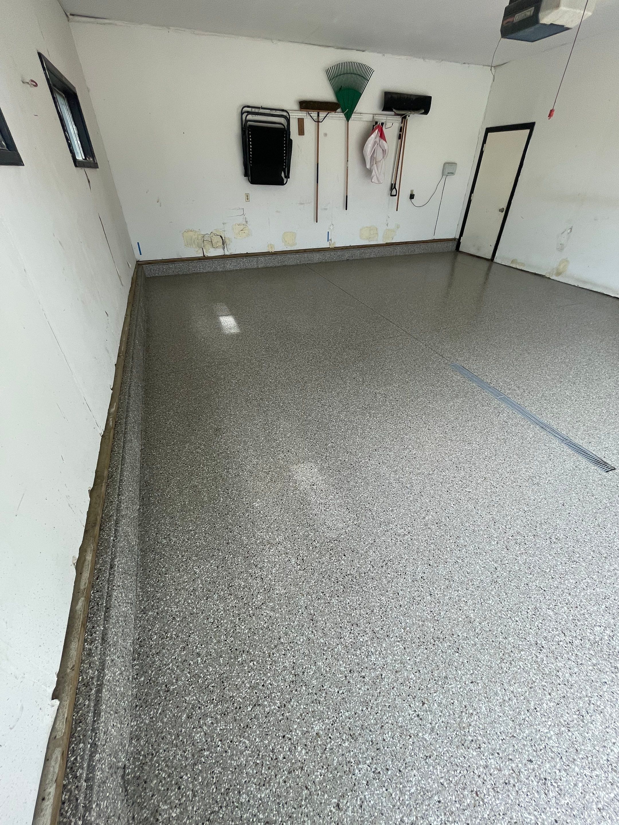 Hartford Residential Garage Floor Transformation With Decorative Chip Coating by Select Painting, Coatings & Garage Cabinets