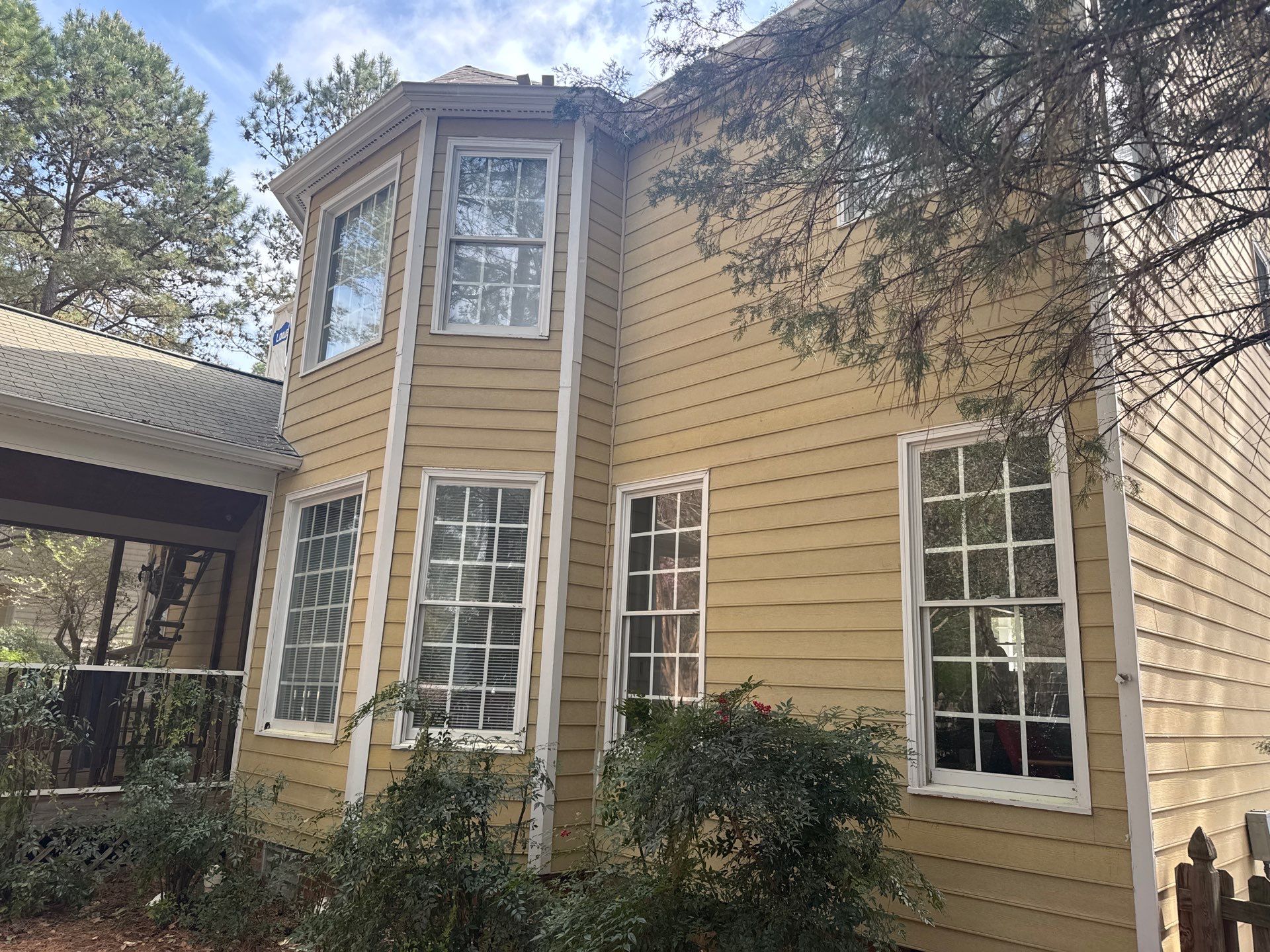 Exterior paint and siding replacement by GonzalezPainters & Contractors Inc 