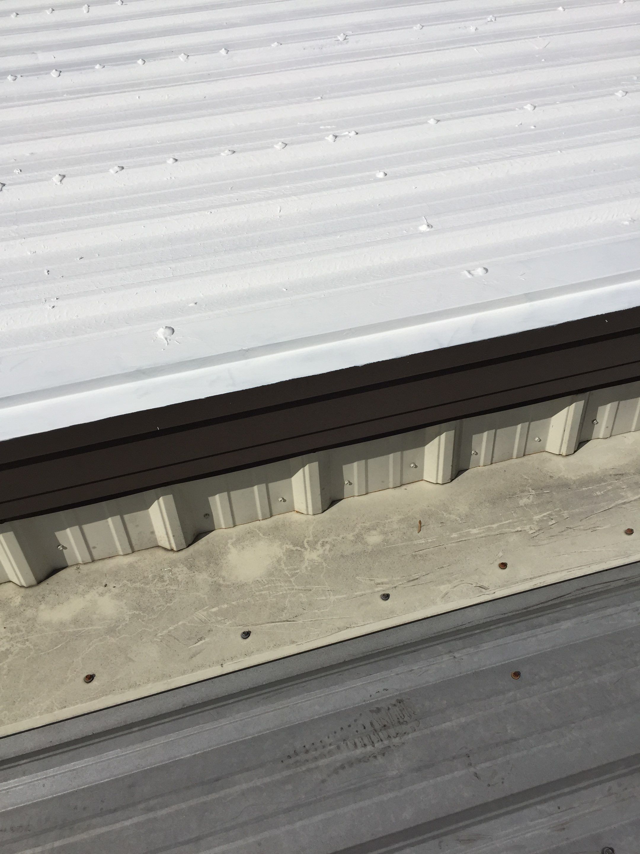 Commercial Roof Coating using Gaco Silicone Roof Coating by Secure Construction Company Inc