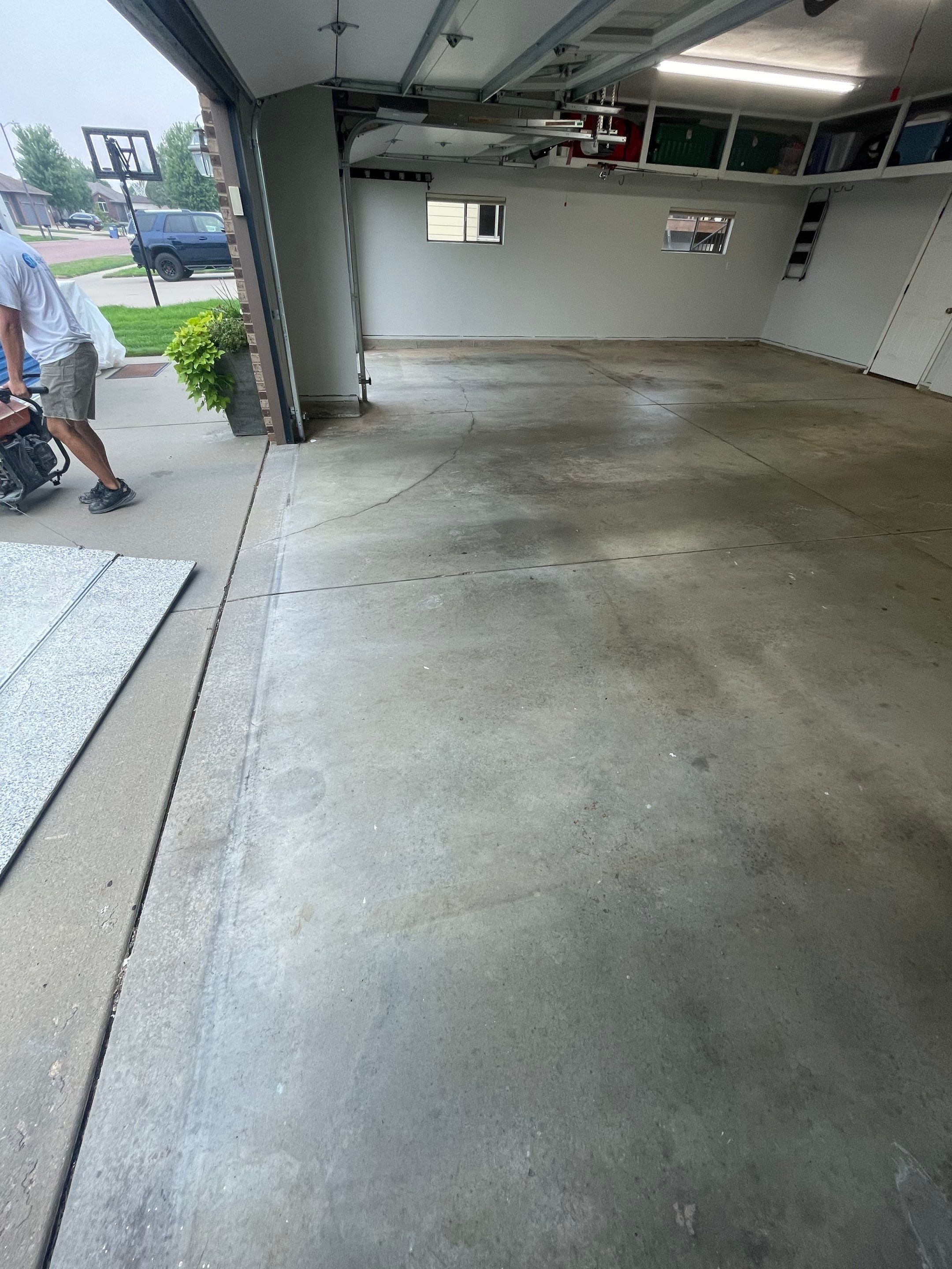 Multi-Car Garage Floor Coating and Crack Repair in Tea by Select Painting, Coatings & Garage Cabinets
