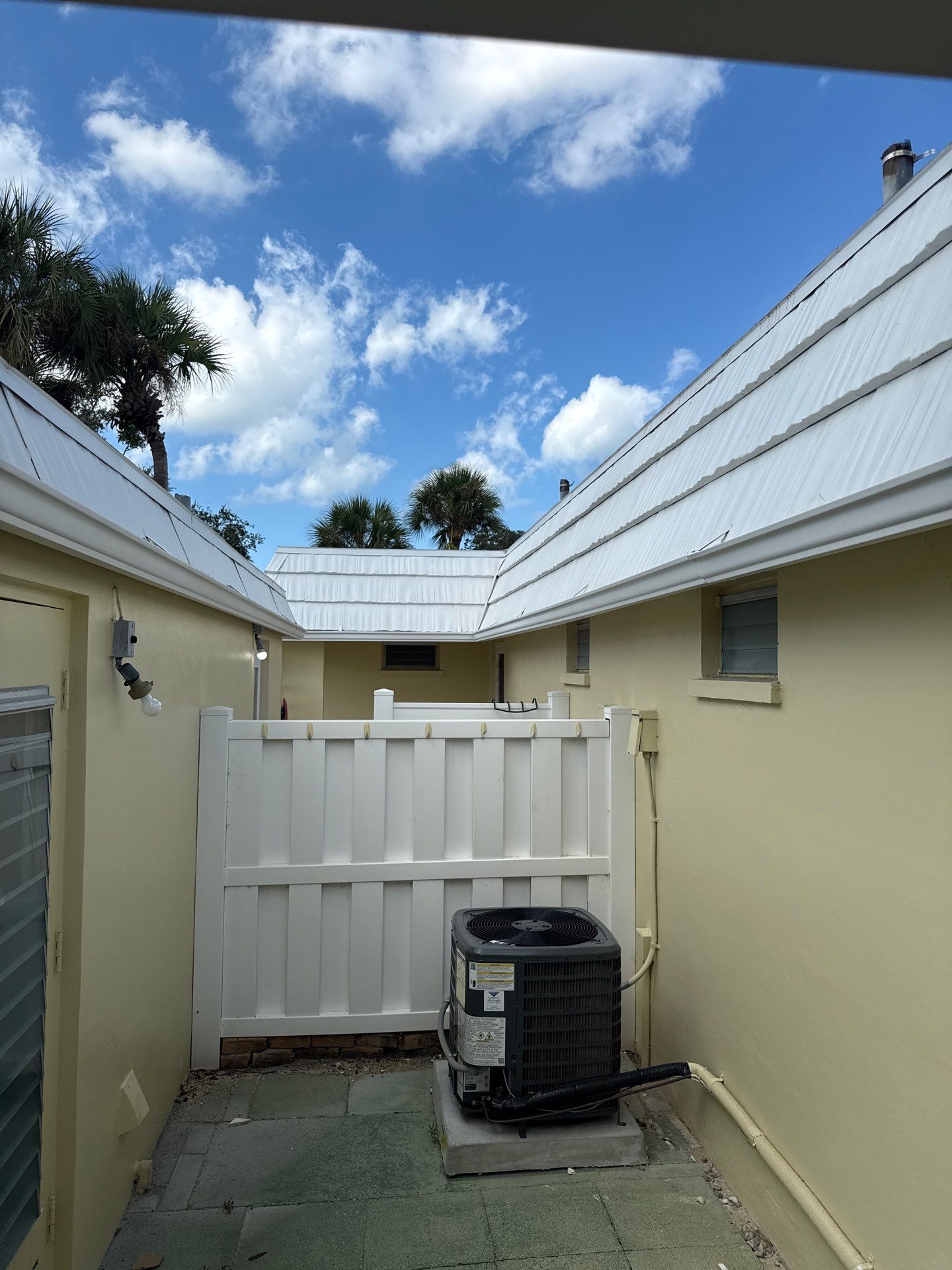 White Gutters and Matching Downspouts in Sarasota FL by Gutter Professors