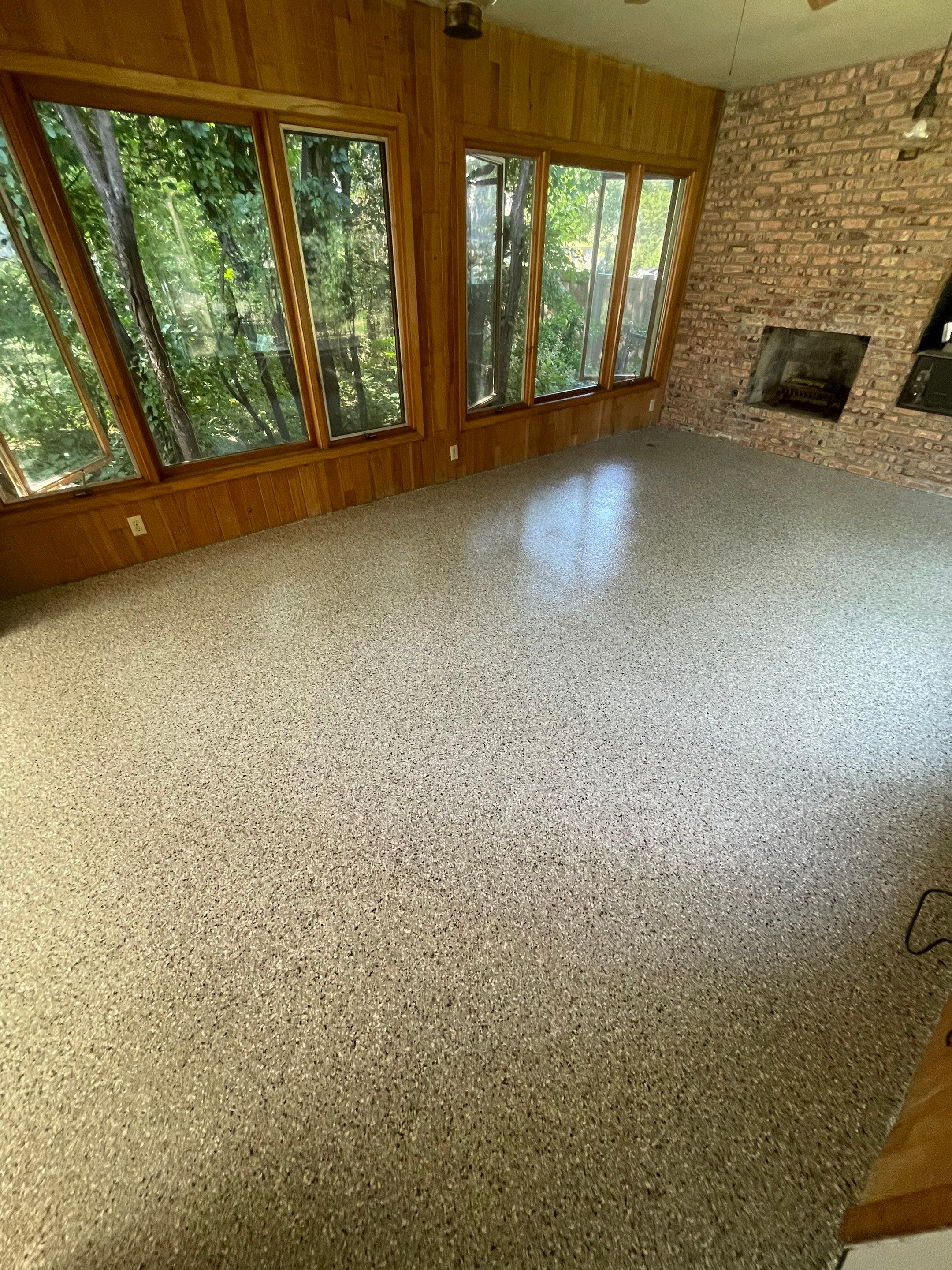 Sioux Falls Garage and Sunroom Concrete Coating with Coyote Flake by Select Painting, Coatings & Garage Cabinets