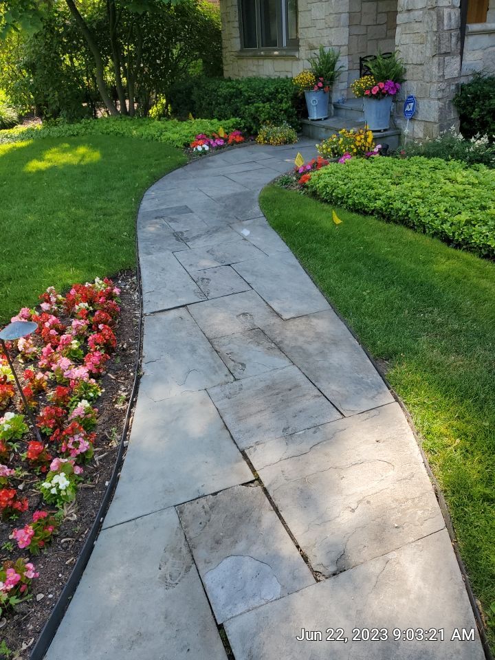 Northbrook, IL stucco home soft wash and stone cleaning by Northern Power Washing LLC.