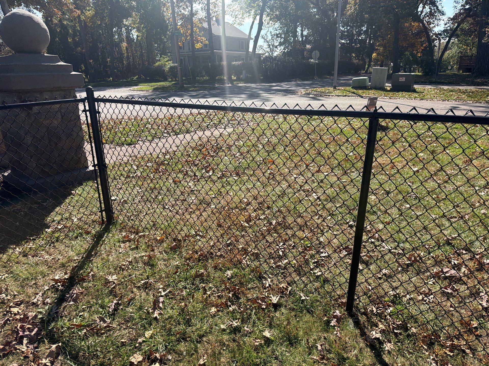 Residential Black Chain Link Fencing in Cedar Falls by Perfect Picket Fence and Stain