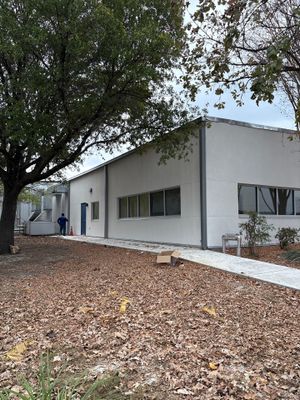 Wide angle view of a completed commercial building exterior.