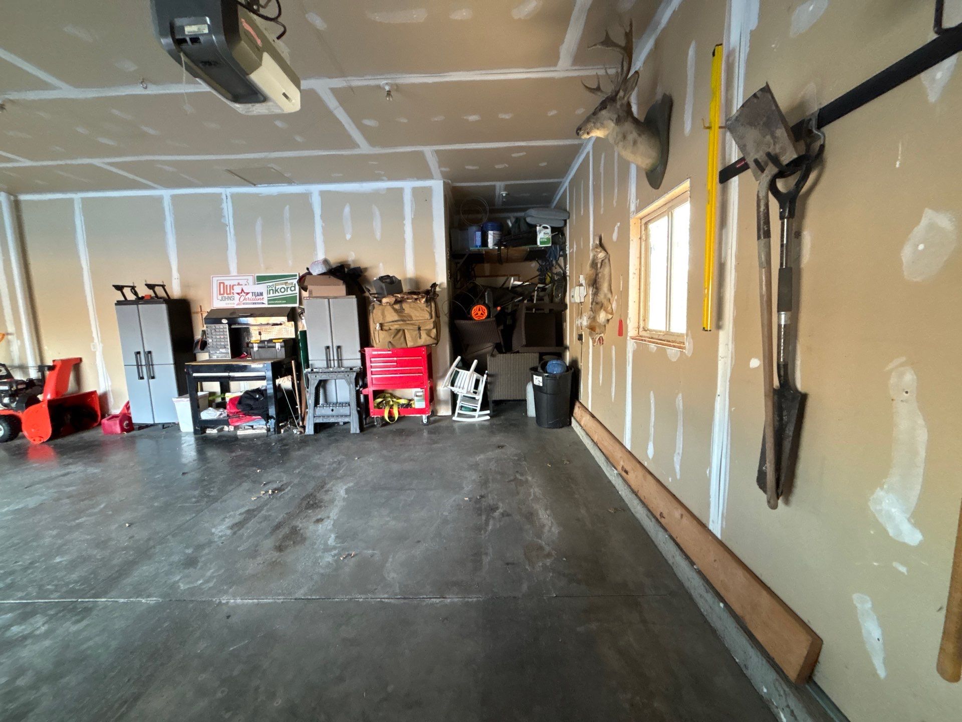Custom Grey Speckled Epoxy Floor Coating for Sioux Falls Garage by Select Painting, Coatings & Garage Cabinets