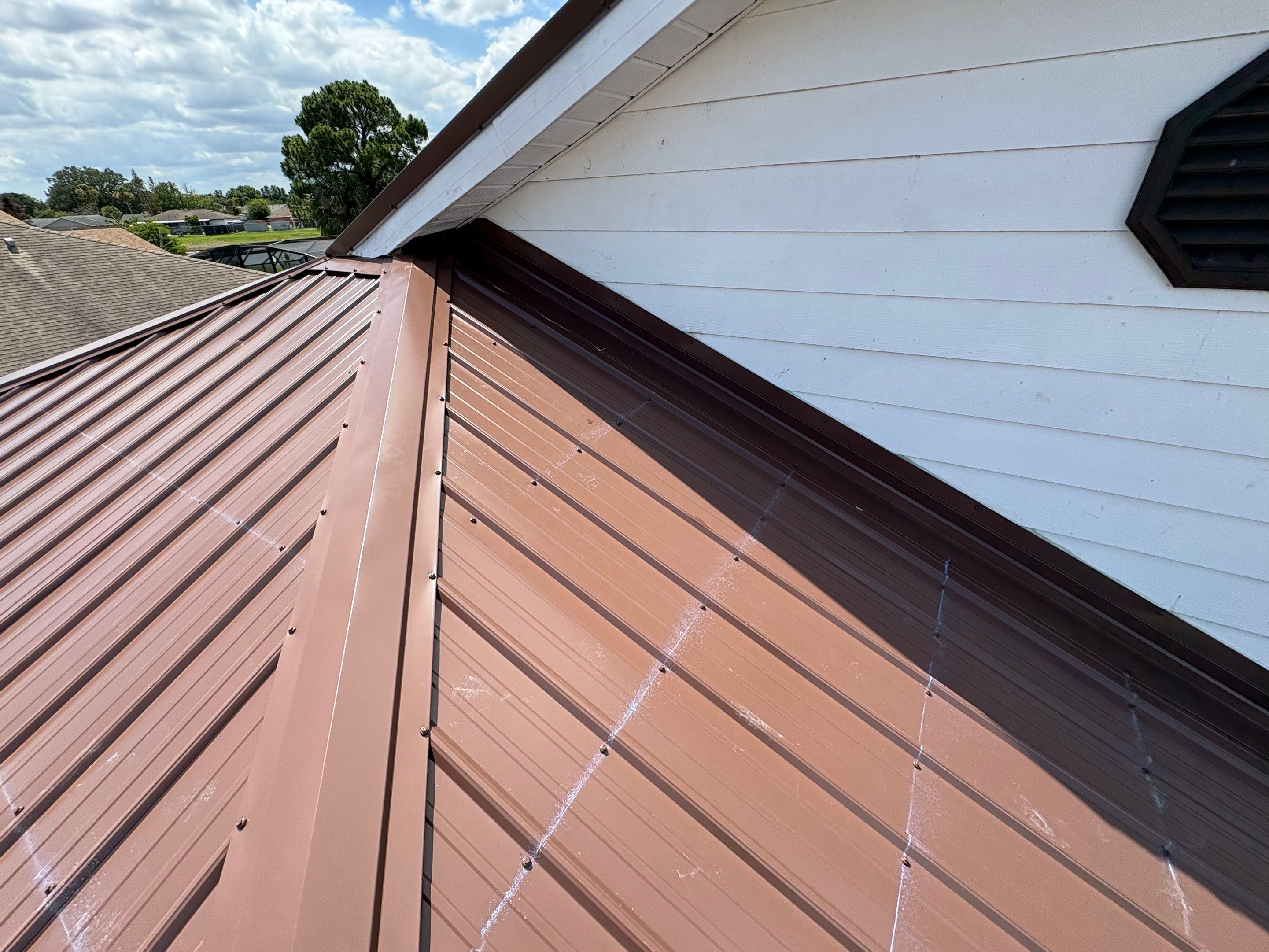 Residential Metal Roofing Installation and Gutter Replacement in Kissimmee by Pinnacle Roofing Group