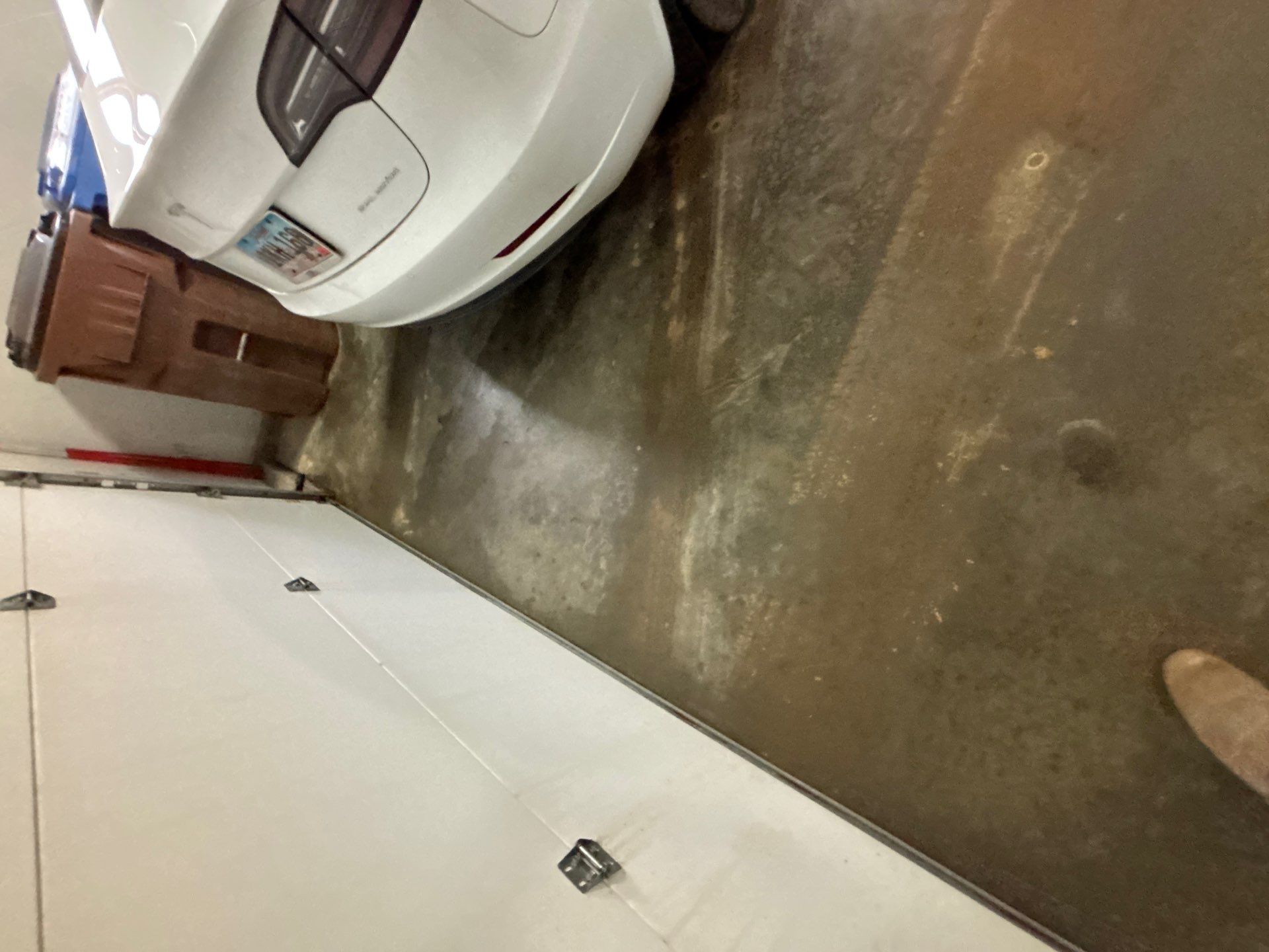 Full Garage Floor and Basement Stair Epoxy Coating in Sioux Falls by Select Painting, Coatings & Garage Cabinets