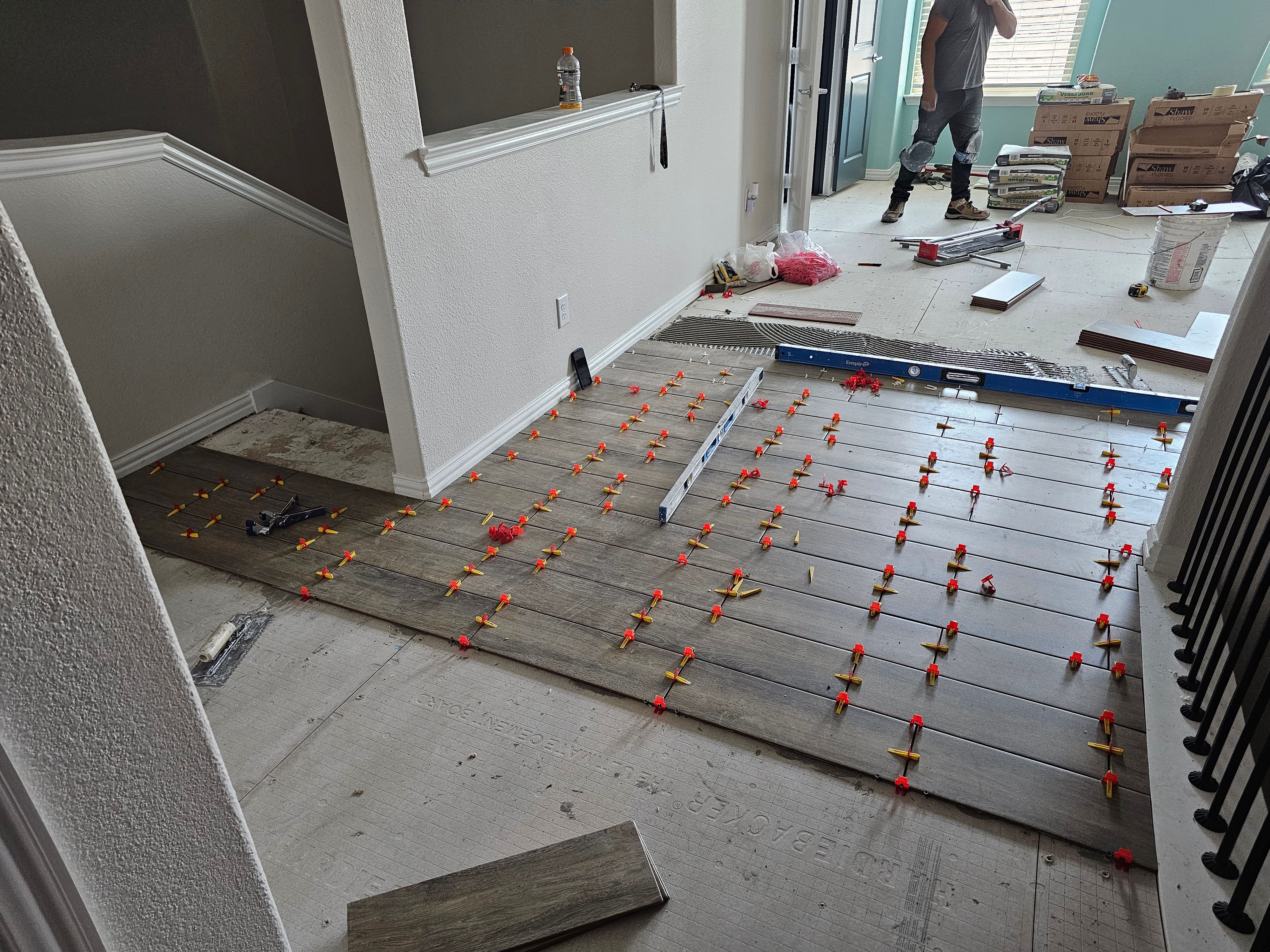 Carpet replacement with Tile and Red Oak Stairs by EL-GC LLC 